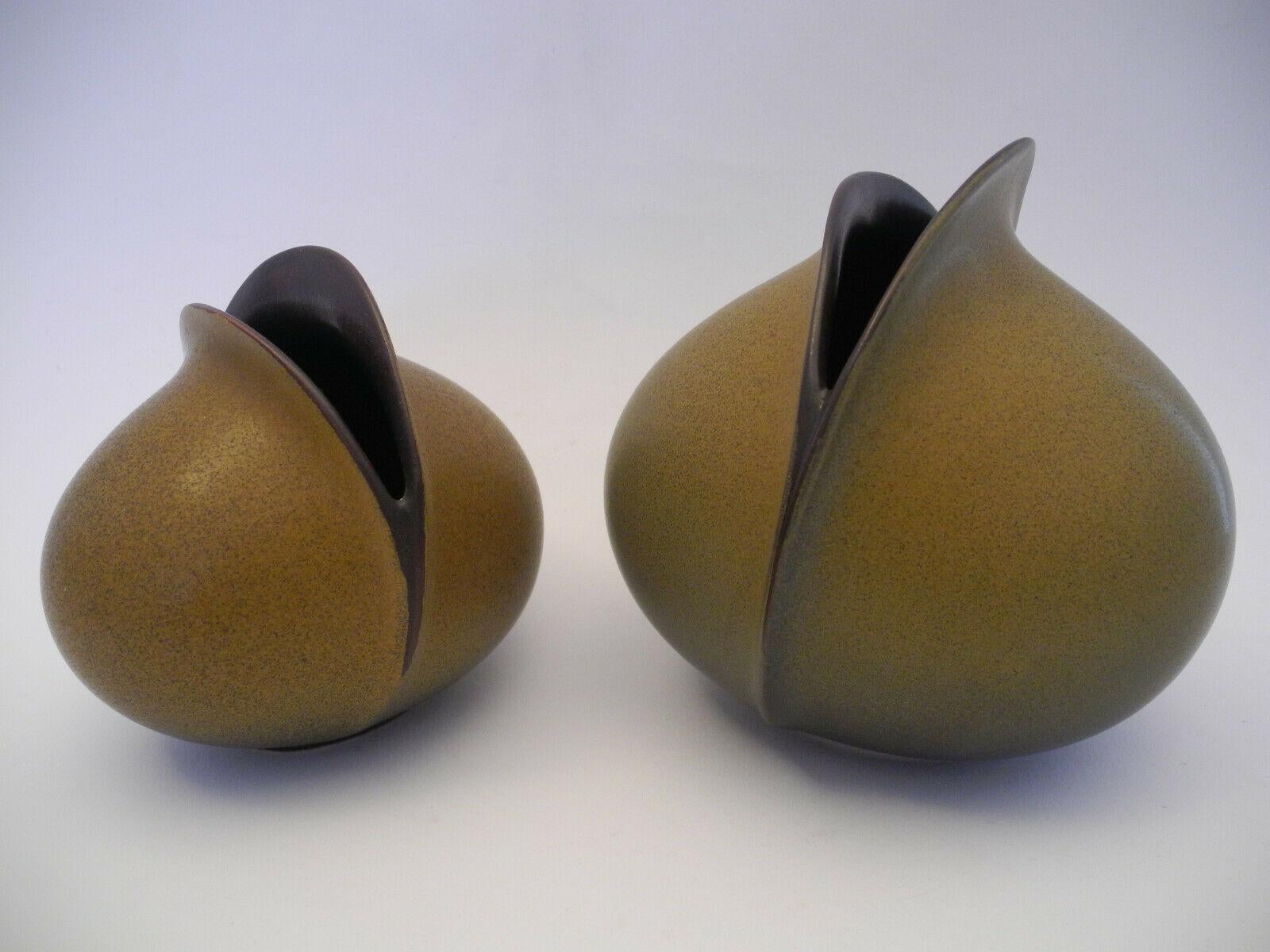 An amazing set of two midcentury studio art ceramic pottery vases made in Germany, by Uta Feyl for Rosenthal, circa 1970s. Vases are in very good condition with no chips, cracks, or flea bites. Signed with manufactory mark. The smaller Vase is
