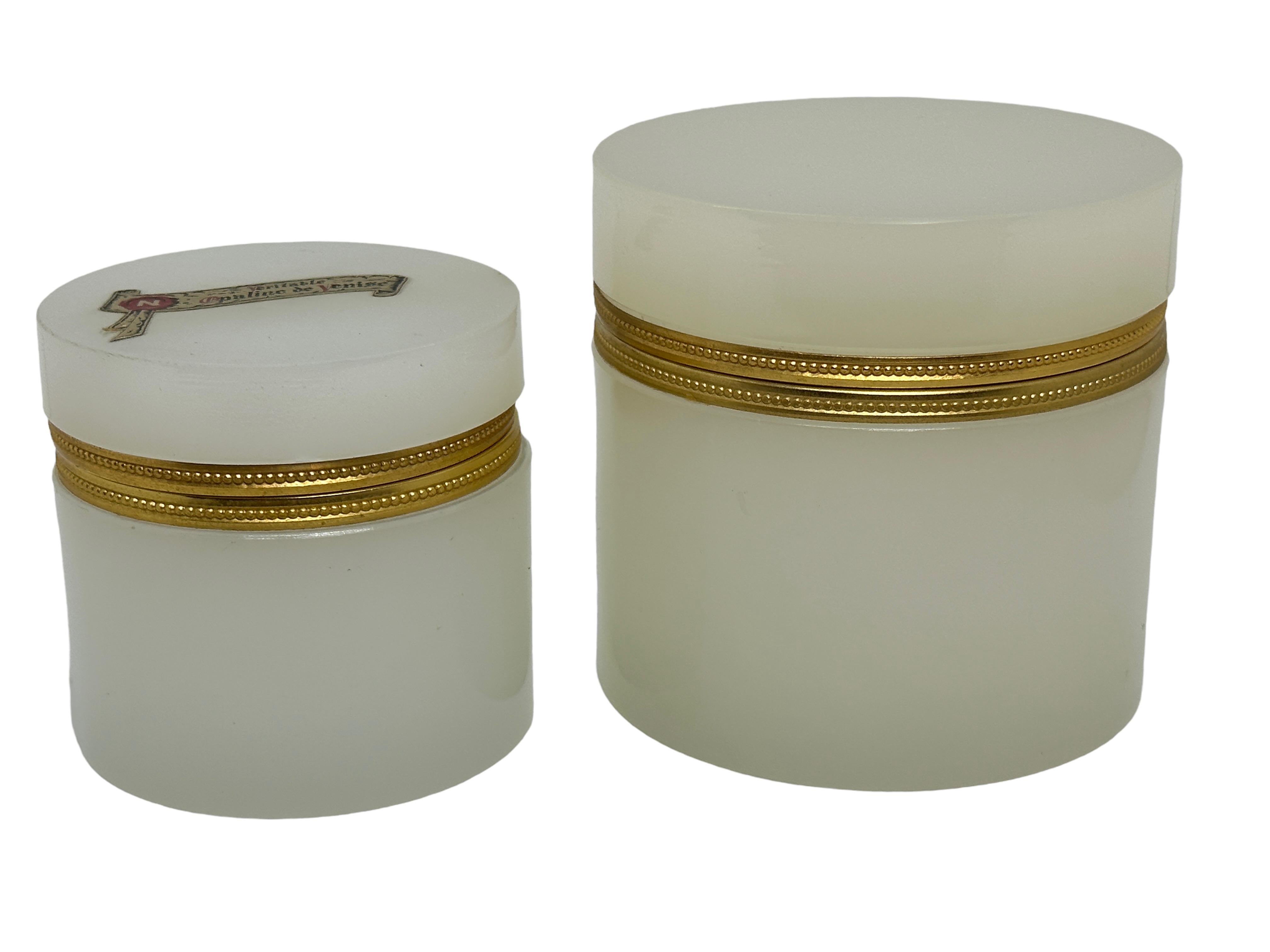A set of two beautiful jewelry boxes with glass lids made of opal glass. This type of jewelry box was mainly made in France, Italy and earlier in Bohemia. They were made from the early 19th century to the mid 20th century. However, the heyday of