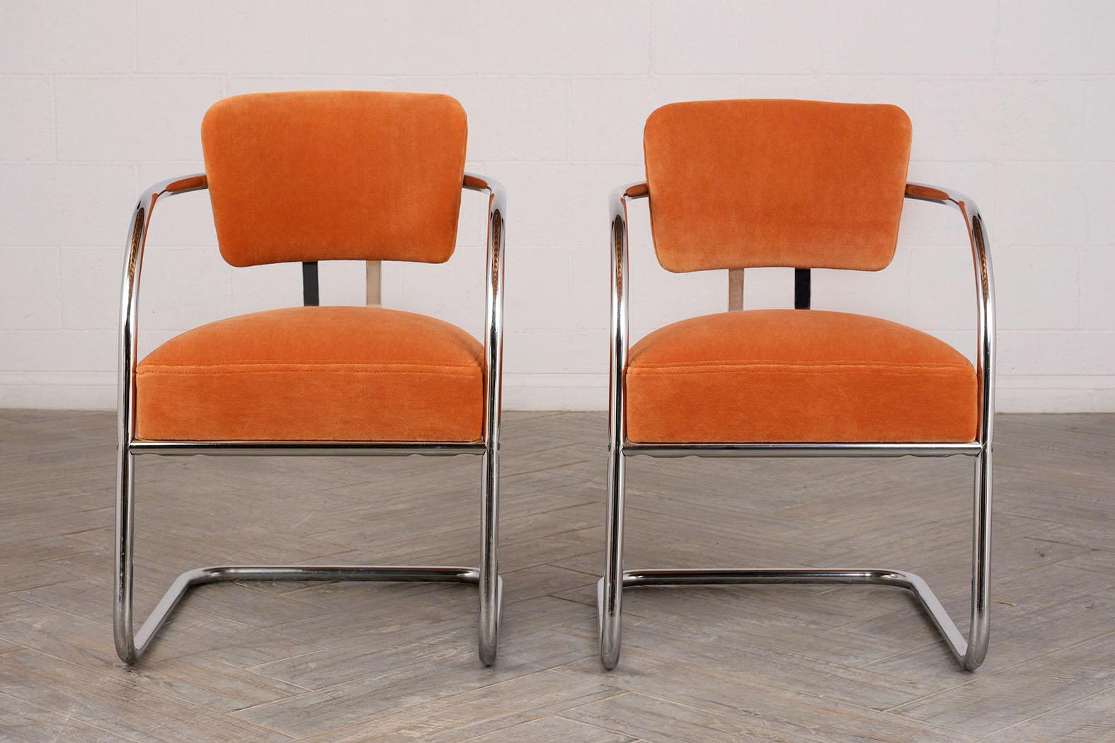 The set of stylish Lounge chairs have unique Toubular chrome frames, the seats and backs have been professionally upholstered in a orange mohair velvet. This pair of armchairs is sturdy, eye-catching, and ready to be used in any home or office for