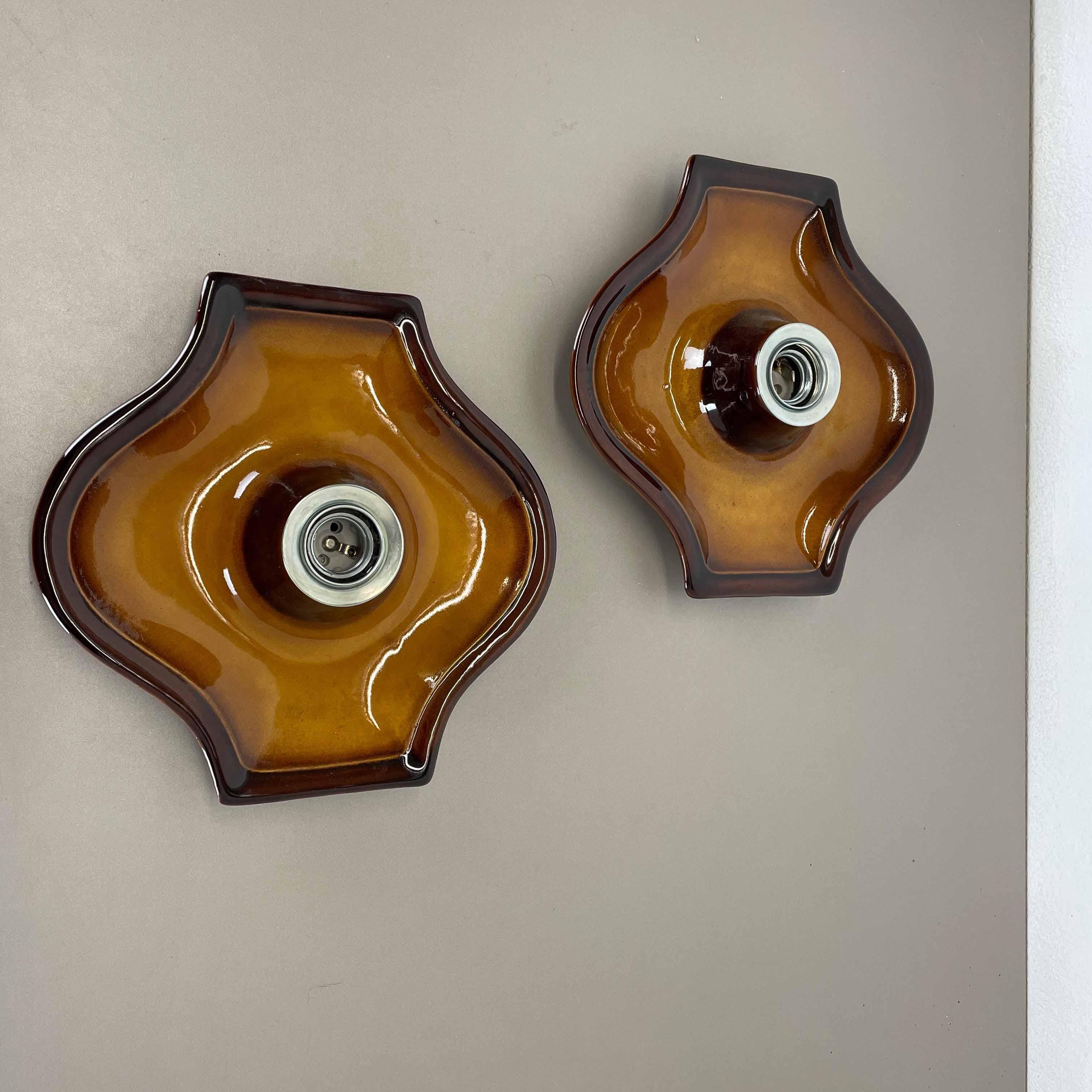 Article:

Wall light sconce set of two.


Producer:

Hustadt Lights, Germany.



Origin:

Germany.



Age:

1970s.



Description:

Original 1960s modernist German wall light made of ceramic in fat lava optic. This super