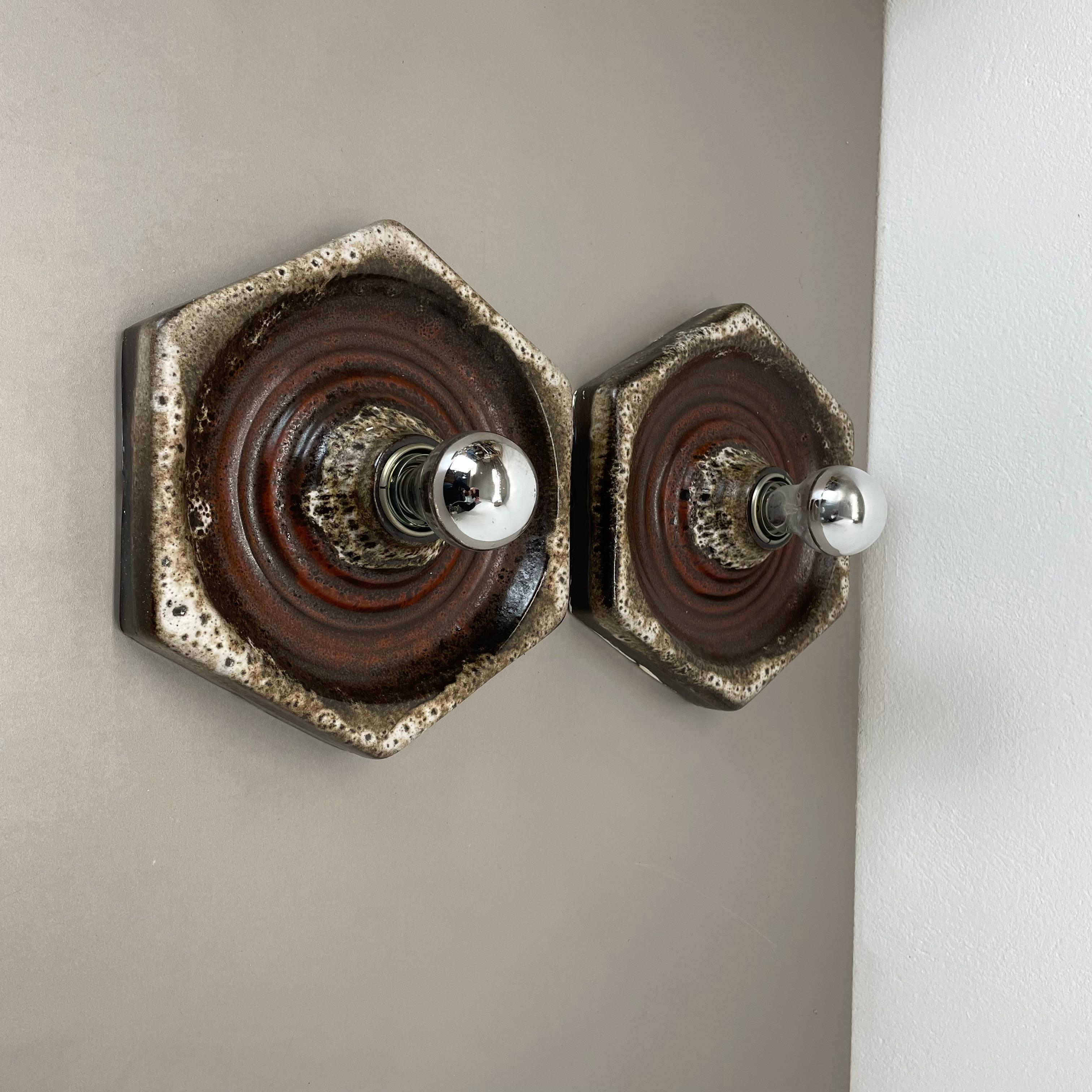 Article:

Wall light sconce set of two.


Producer:

Pan Ceramic, Germany.



Origin:

Germany.



Age:

1970s.



Description:

Original 1970s modernist German wall light made of ceramic in fat lava optic. This super rare set of two walls light was