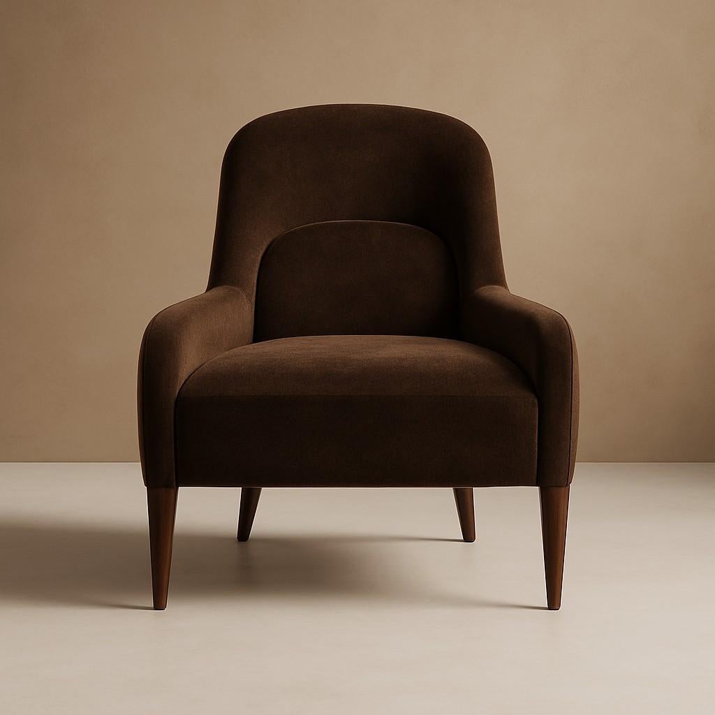 This set of two Montreux armchairs brings retro-inspired elegance to life through soft sculptural lines and enveloping comfort. Upholstered in a sumptuous chocolate velvet, the chairs feature subtly quilted backrest panels that enhance both