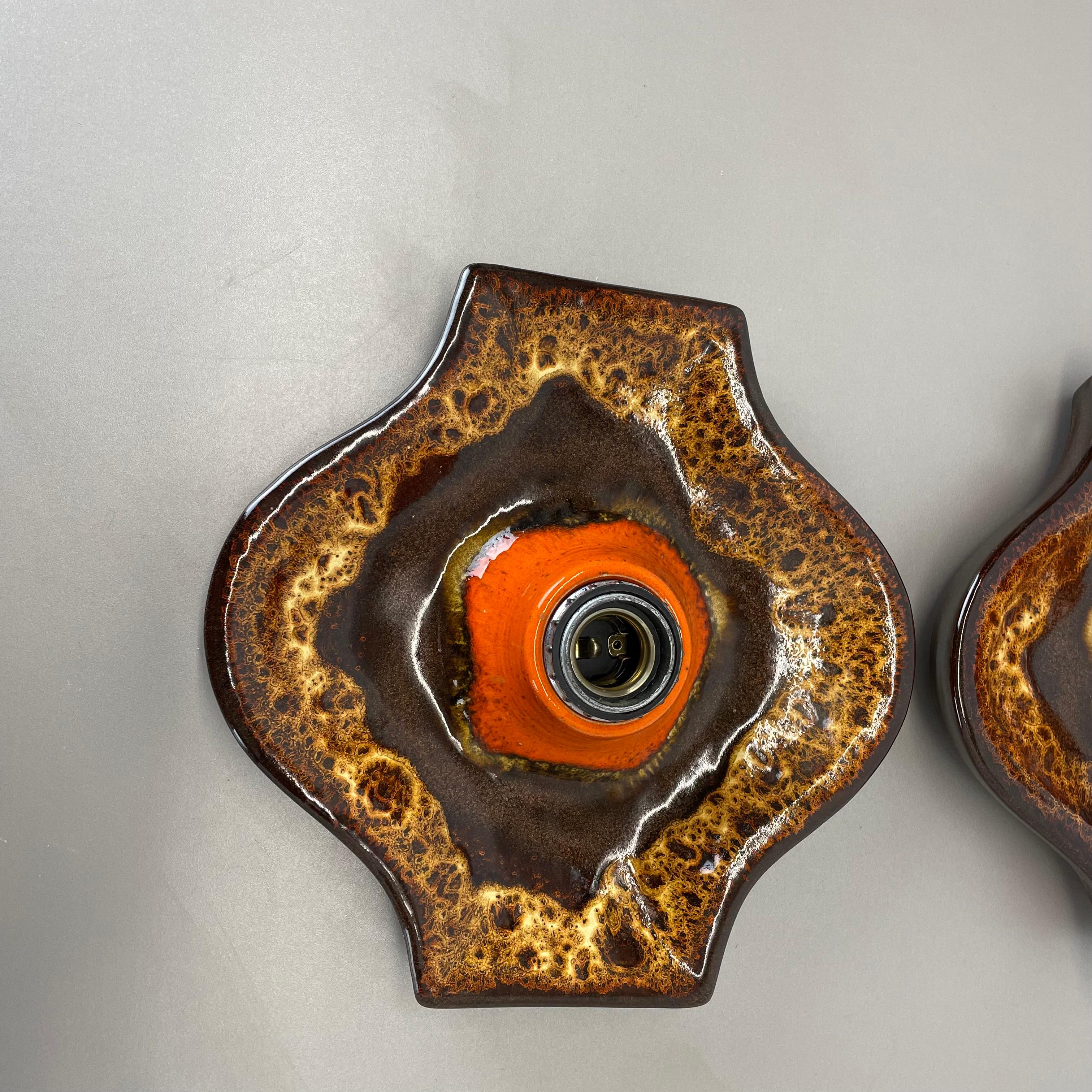 Article:

Wall light sconce set of two.


Producer:

Hustadt Lights, Germany.



Origin:

Germany.



Age:

1970s.



Description:

Original 1970s modernist German wall light made of ceramic in fat lava optic. This super rare set of two walls light