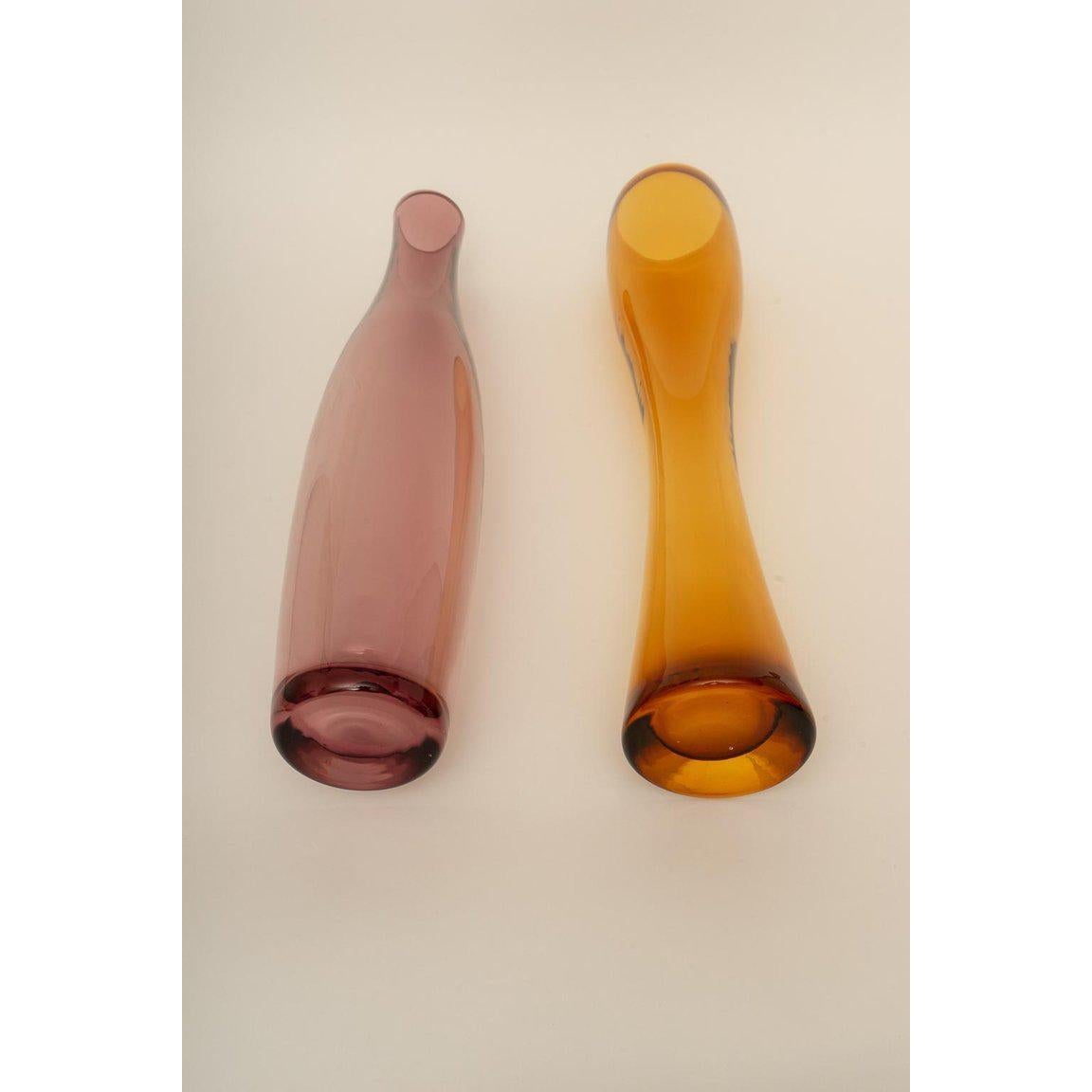 This stylish set of Italian, Oggetti Murano glass vases could be used as pure decoration or perhaps to hold you favorite cut flowers, bamboo or reeds. 

Note: Dimensions of the purple vase are 21.25