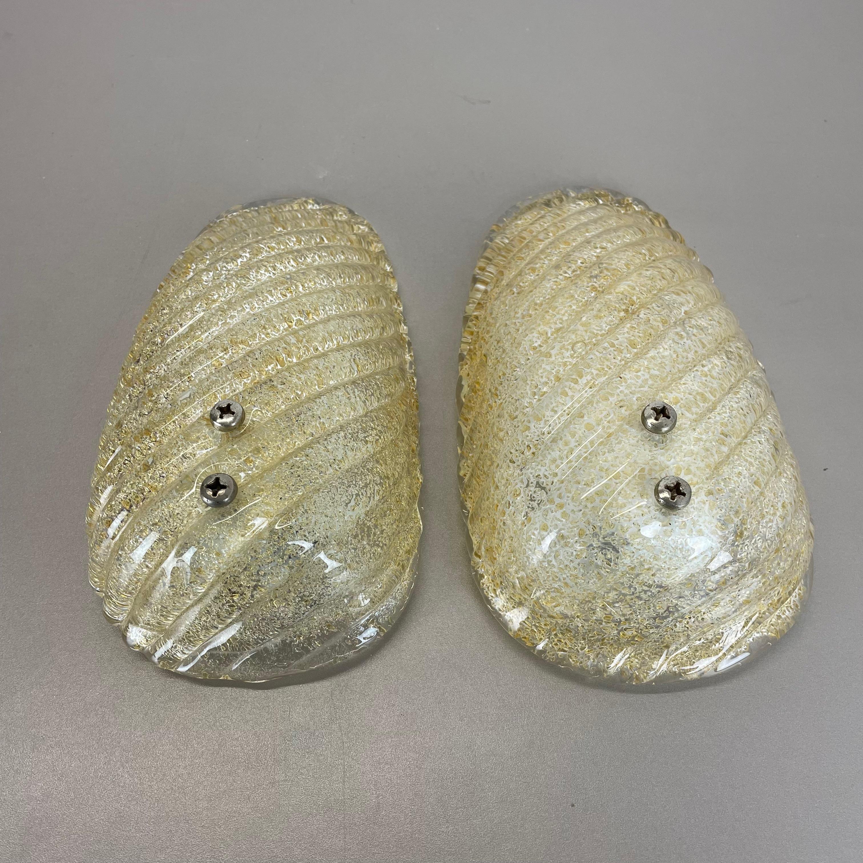 Article:

Set of two

Wall light sconces


Origin:

Germany



Age:

1980s



This set of two modernist lights was produced in Germany in the 1980s. It is made from murano glass front plate element and has a metal wall fixation.