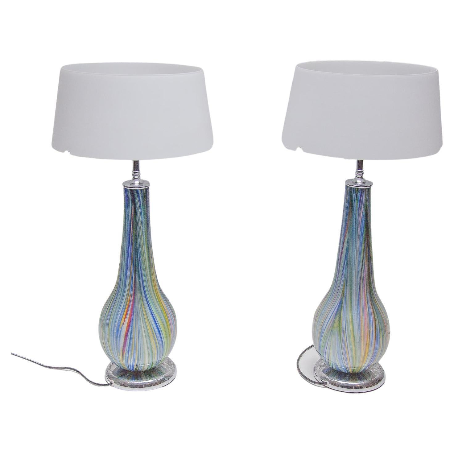 Impressive, 1980s pair of Murano glass table lamps featuring a wonderful mouth blown Millefiori glass vase by Alfredo Barbini. These beautiful lamps have been newly rewired. The chrome hardware has been cleaned and polished. The lamps give an air of