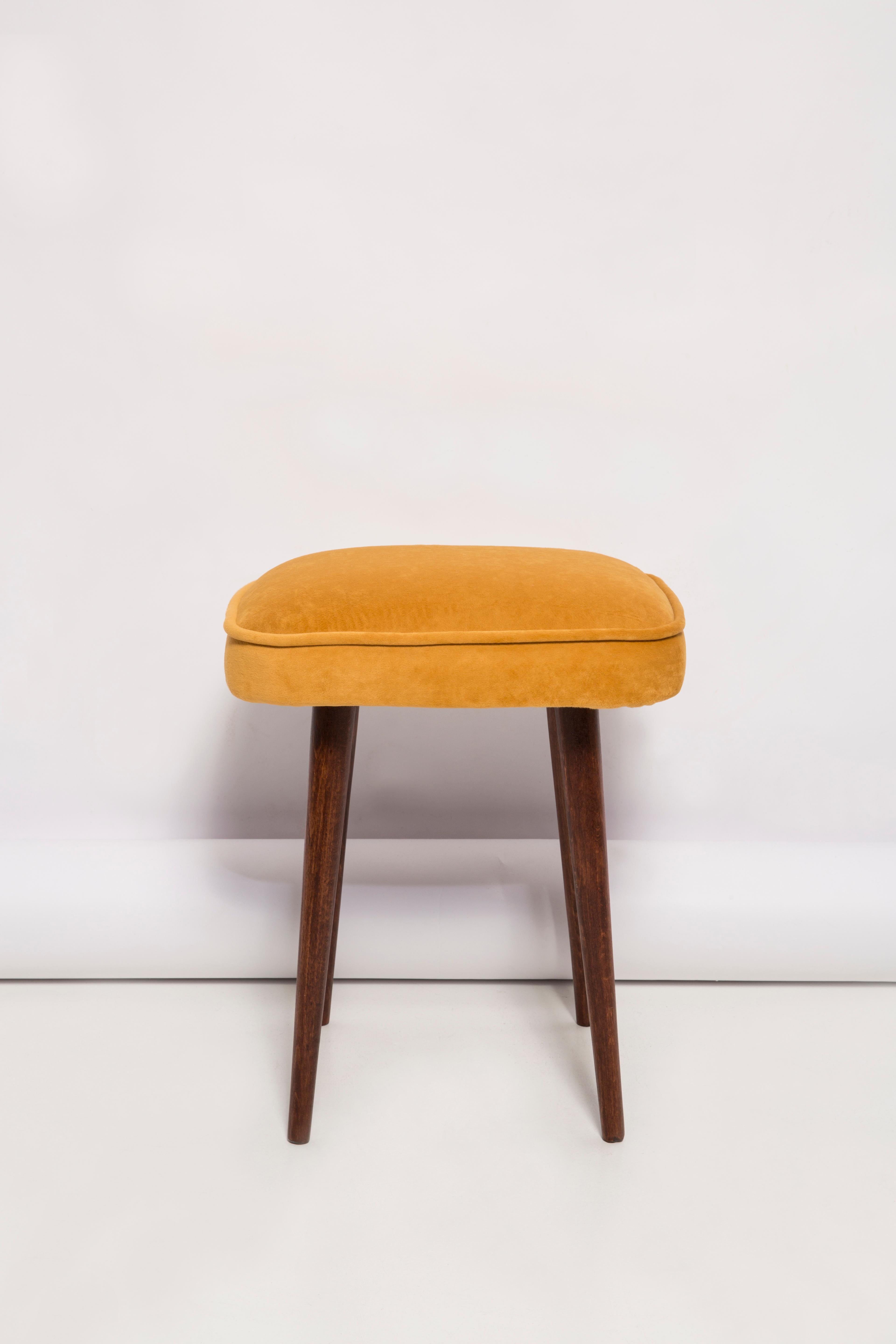 Stools from the turn of the 1960s and 1970s. Beautiful mustard velor upholstery. The stools consists of an upholstered part, a seat and wooden legs narrowing downwards, characteristic of the 1960s style. We can prepare this pair also in another