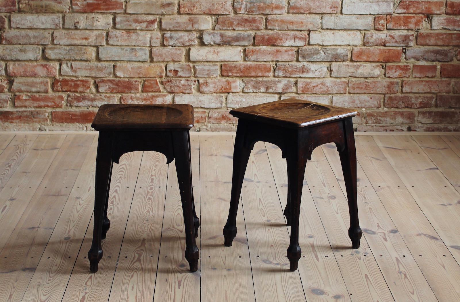 These oak stools probably come from Germany from early 20th century. They feature comfortable profiled seating and beautifully sculpted legs. They wear some patina consistent with age and use that only brings them charm and authencity. Can be also