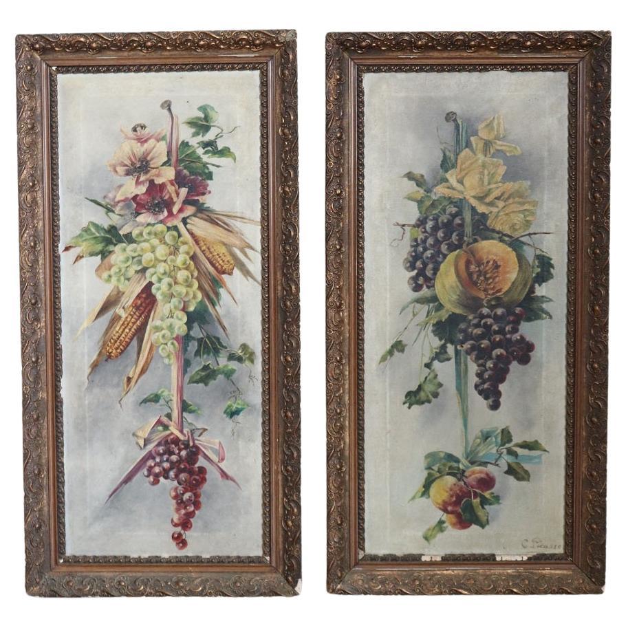 Ensemble de deux peintures à l'huile sur toile, signées, composition de fleurs et de fruits en vente