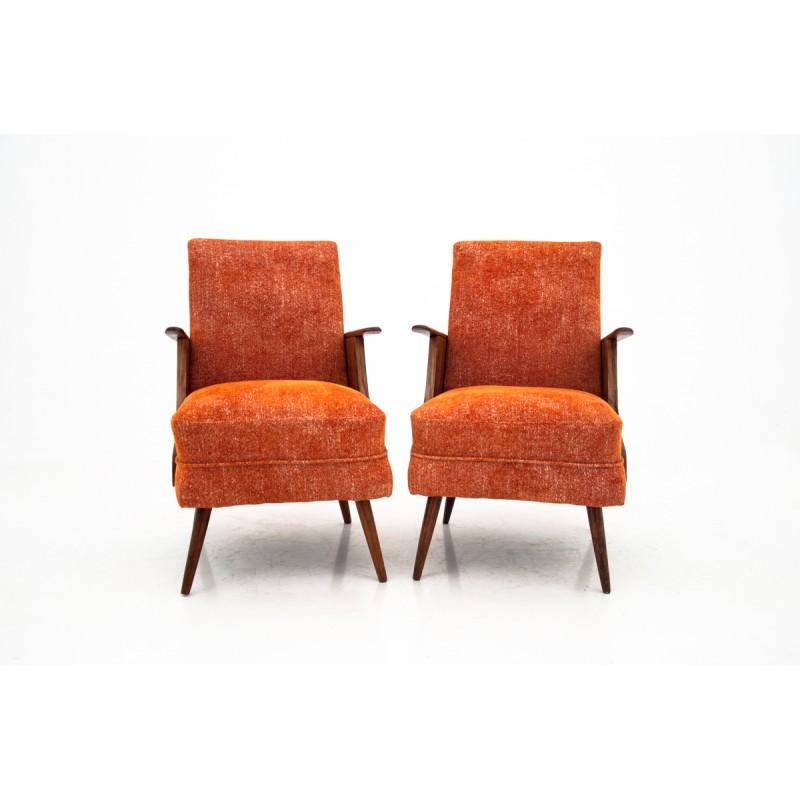 Set of two Mid-Century Modern armchairs from Poland, from circa 1950s.
Unique form, after wood renovation and reupholstered in orange material.
Comfortable and stabile. 
   
  