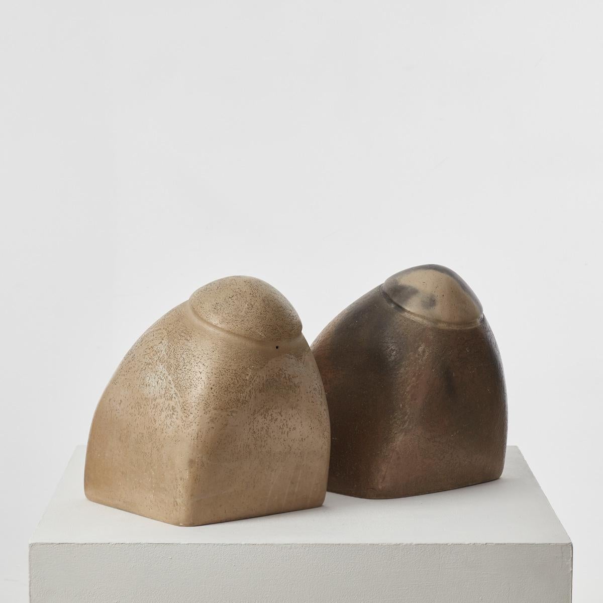 A set of two large, biomorphic plaster sculpture with a burnished finish that sits as solid pieces with a dynamic slanted axis. 
They were previously owned by Sir Terence Conran (1931 – 2020). Conran, an inimitable design pioneer and businessman,