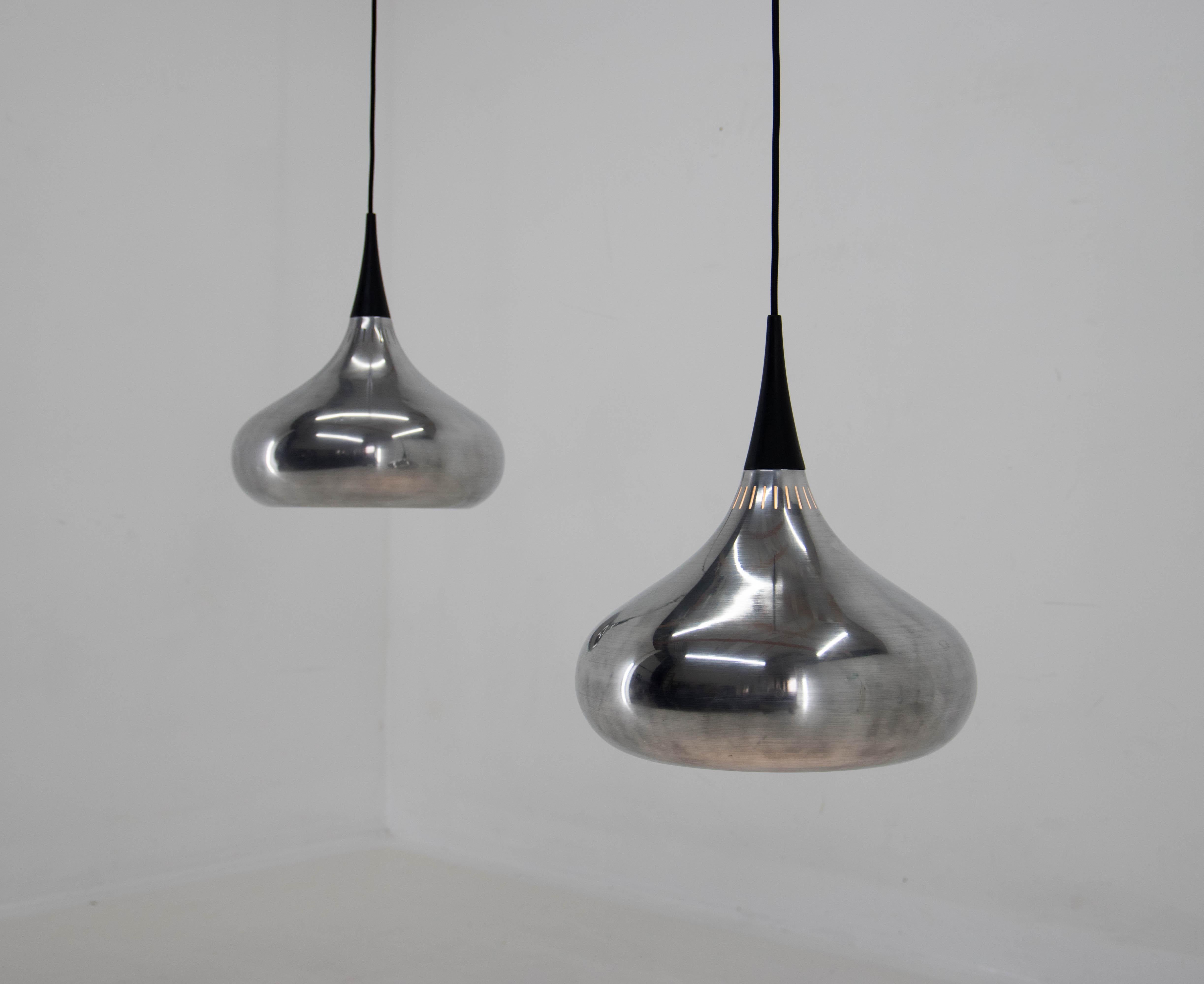 The orient pendant was designed by Jo Hammerborg in the 1960s. 
Aluminum was polished. New white paint inside.
Rewired with textil cable. Minor imperfections visible on pictures.
Max height including cable 128cm can be easily shorten.
E25-E27 bulb, 