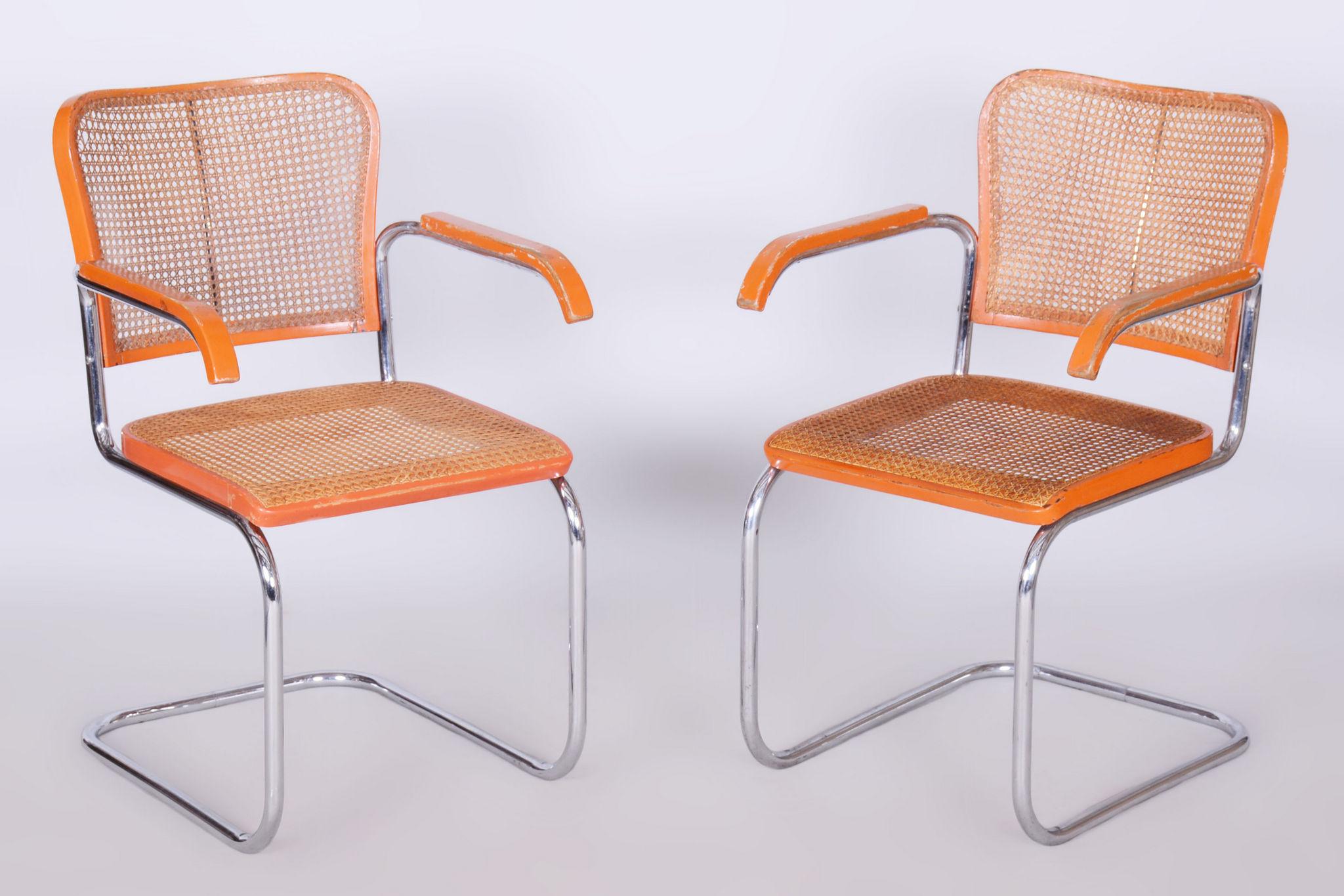 Set of two restored beech Bauhaus Armchairs.

Style: Bauhaus
Maker: Robert Slezak
Period: 1930-1939
Source: Czechia
Material: Beech, Chrome-plated Steel, Rattan.

In pristine original condition, the item has been professionally cleaned, and its