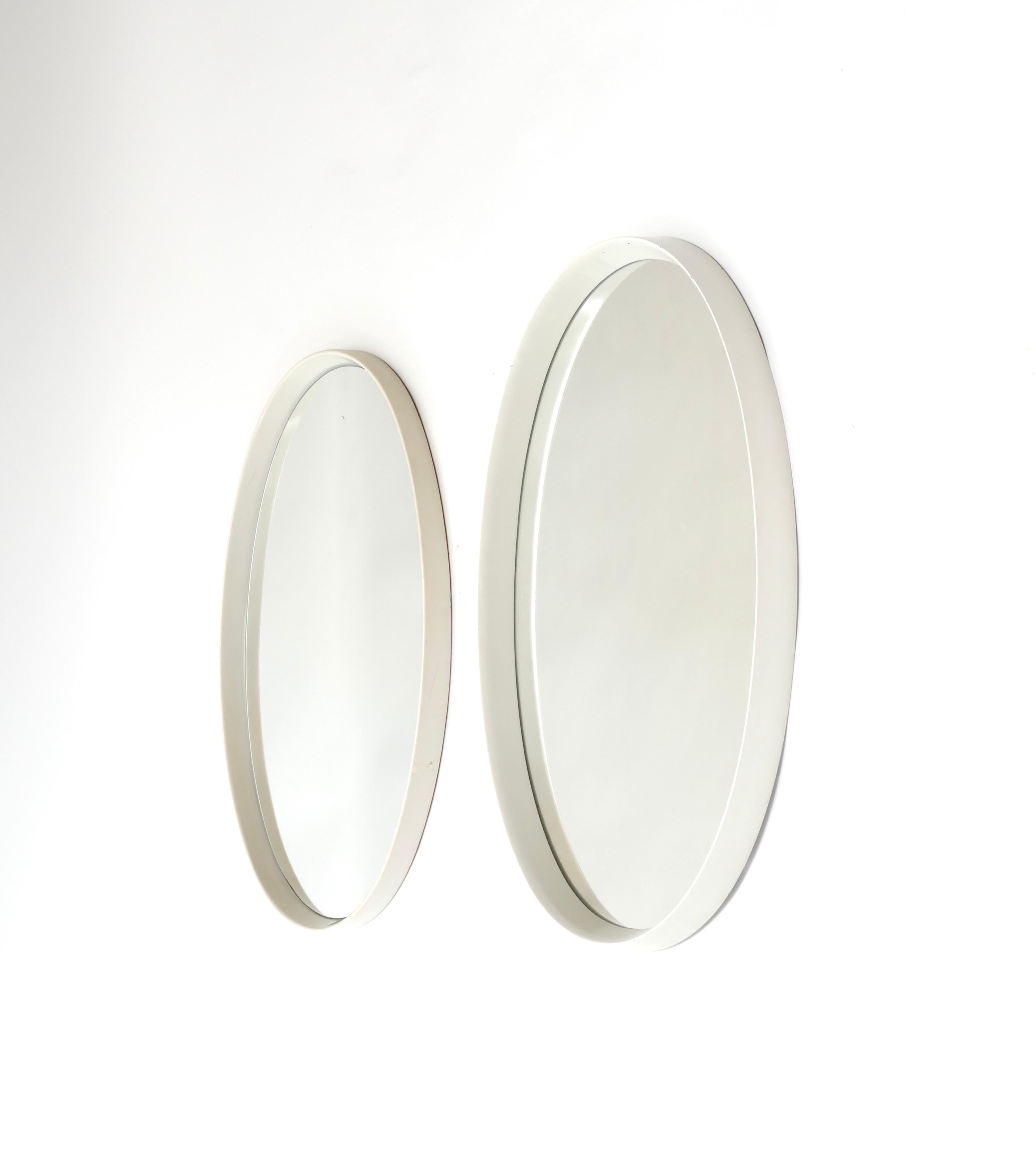 Set of two oval mirrors with a wood white lacquered frame, Germany, 1970s
One 79cms high, 49 cms wide, 5.5 cms deep
The other 78cms high, 50.5 cms wide, 4 cms deep.
