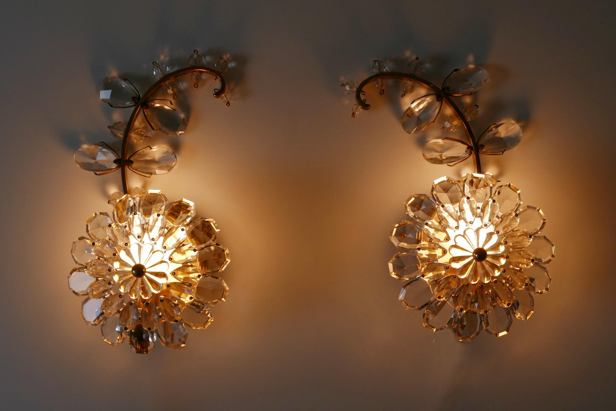 Set of two highly decorative and beautiful Mid-Century Modern crystal and gilt brass flower sconces or wall lamps. Manufactured by Palwa, 1960s, Germany.

Executed in gilt brass and crystal glass, each lamp needs 1 x E14 / E12 Edison screw fit