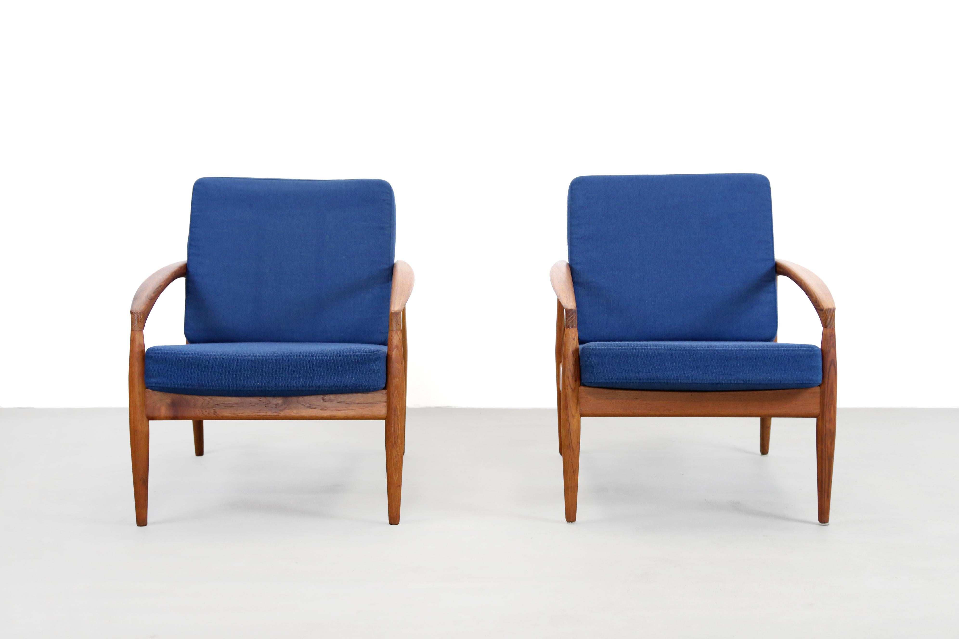 A beautiful set of two armchairs designed by Kai Kristiansen, produced by Magnus Olesen in Denmark. This model, 
