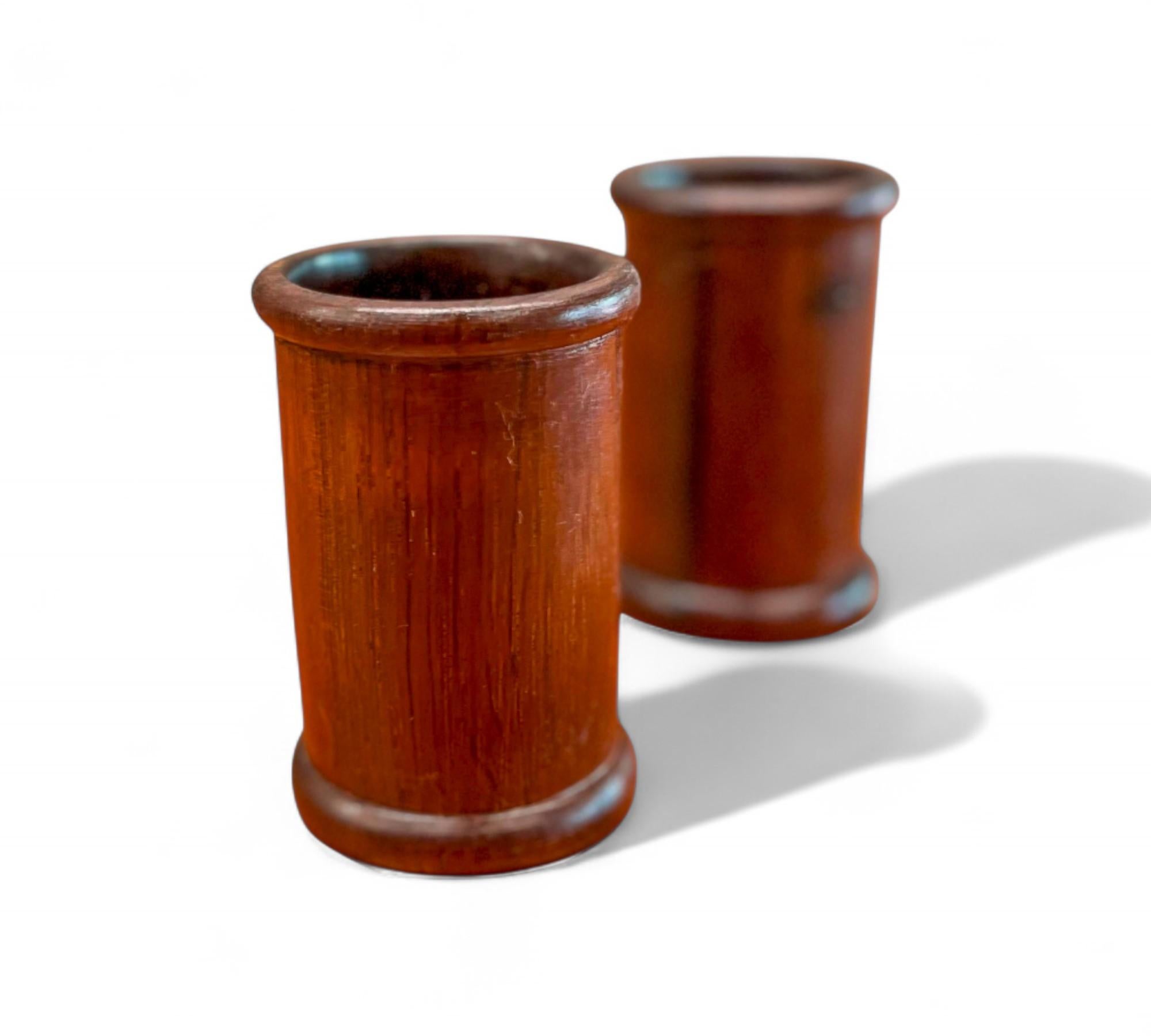 Beautiful pair of pen holders made of solid turned rosewood.