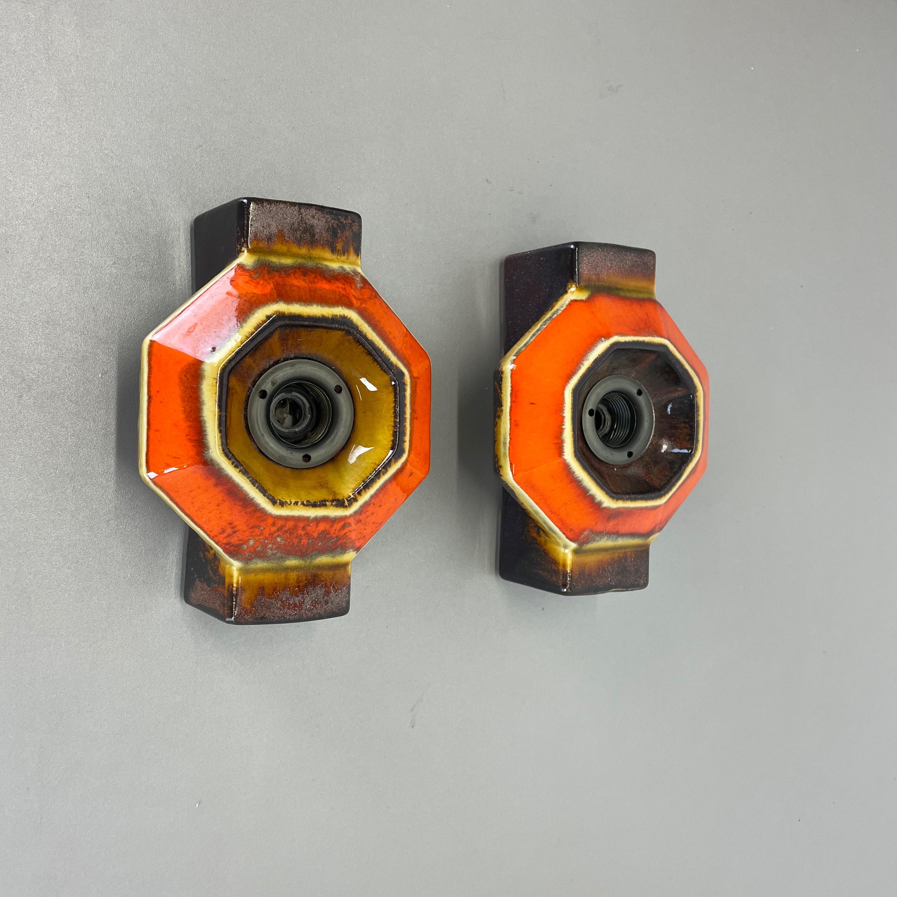 Article:

Wall light sconce set of two.


Producer:

Pan Ceramic, Germany.



Origin:

Germany.



Age:

1970s.



Description:

Original 1970s modernist German wall light made of ceramic in fat lava optic. This super rare