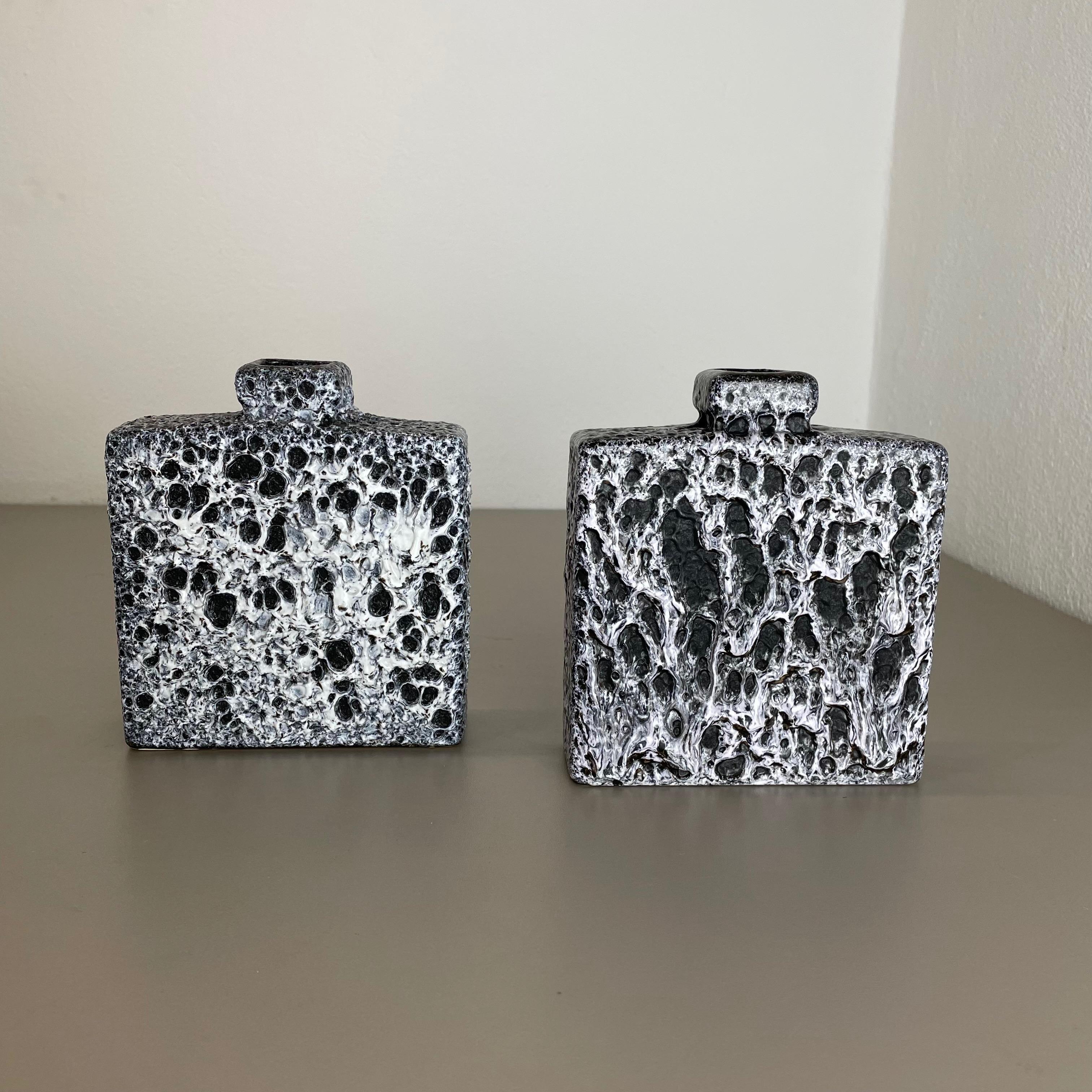 Article:

Set of two fat lava art vases.




Producer:

Jopeko Ceramics, Germany



Decade:

1970s




These original vintage vases was produced in the 1970s in Germany. It is made of ceramic pottery in fat lava optic. Super rare