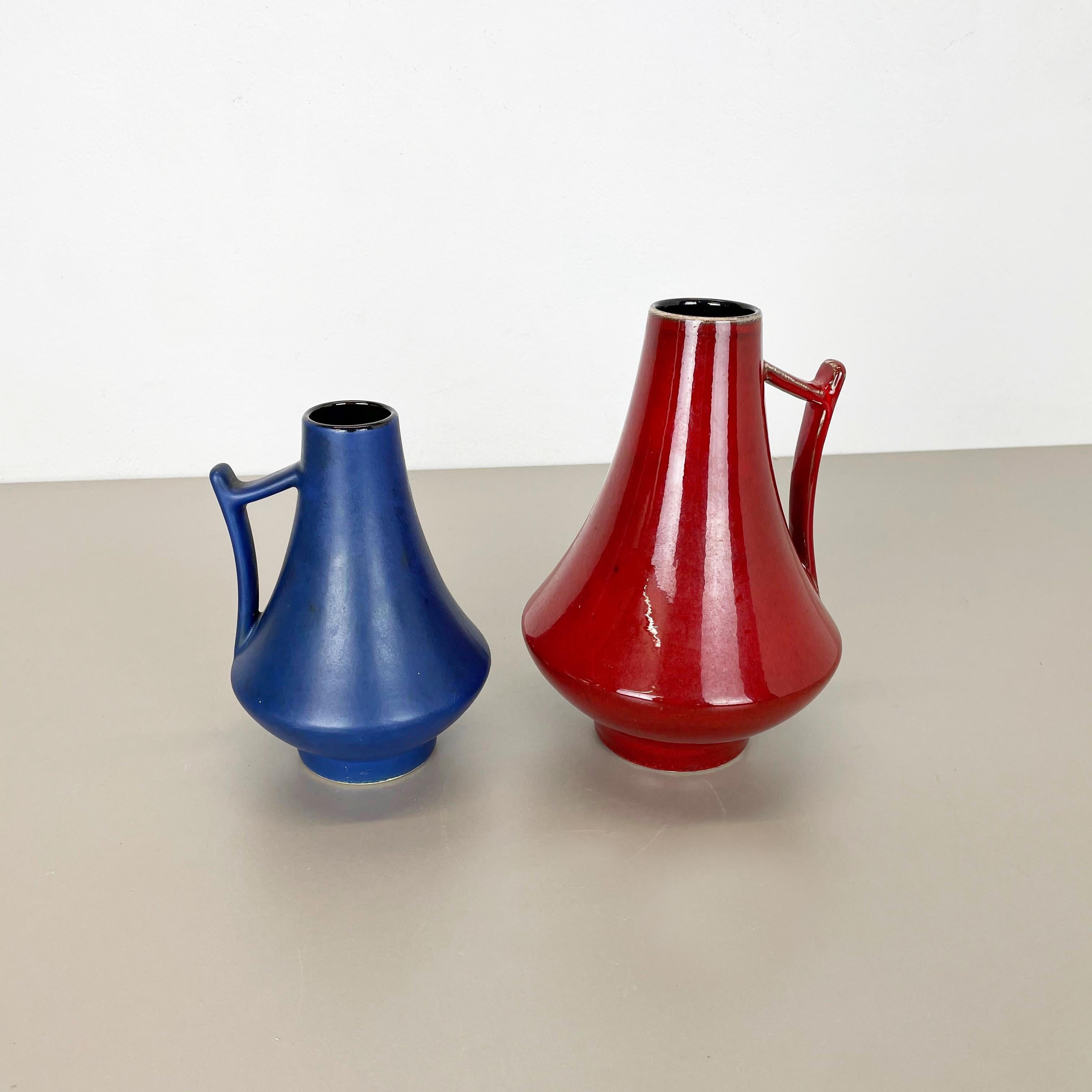 Article:

Set of two fat lava art vases

Model:
44/25 
44/20



Producer:

Jopeko Ceramics, Germany



Decade:

1970s




These original vintage vases was produced in the 1970s in Germany. It is made of ceramic pottery in fat