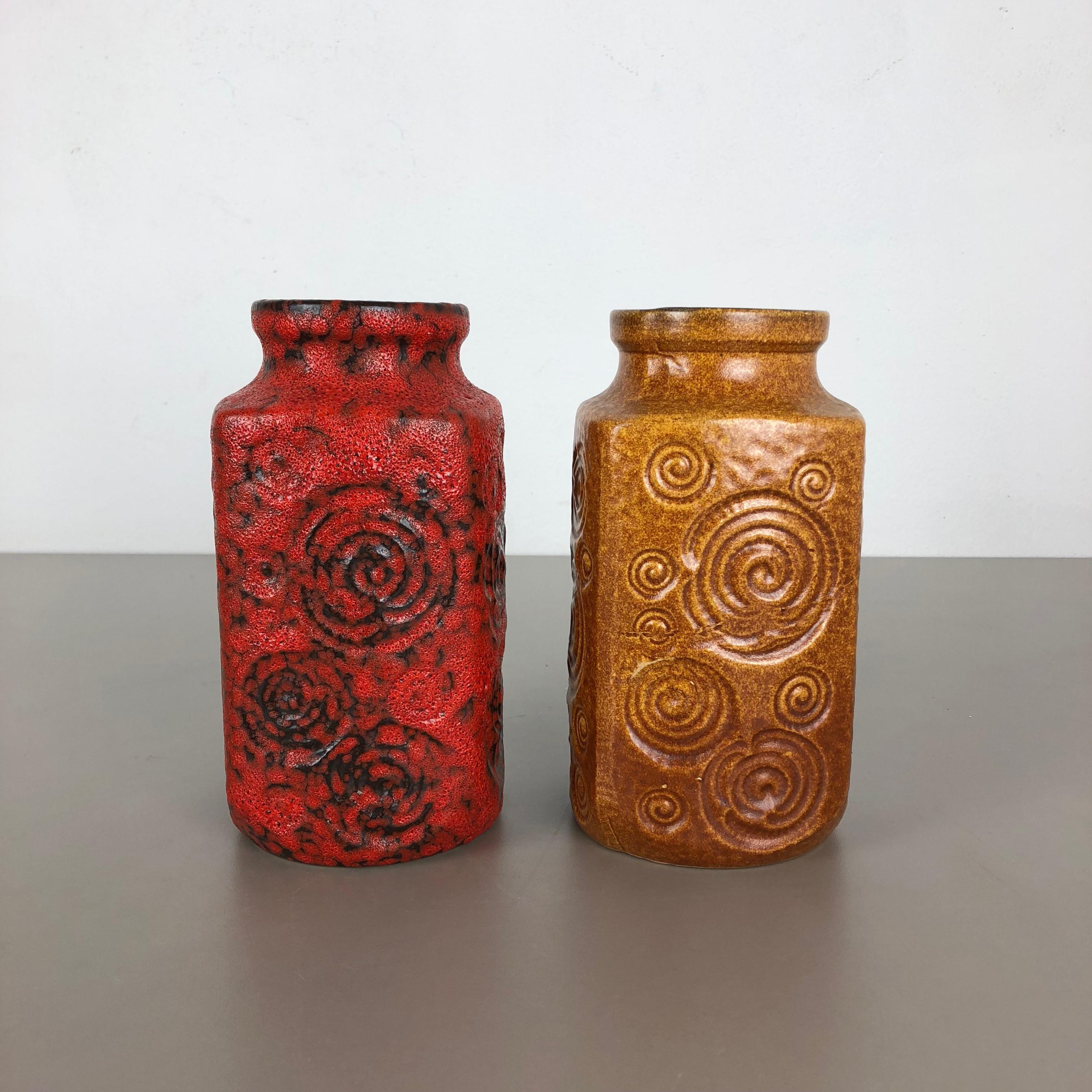 Article:

Set of two fat lava art vases

Model: Jura 282-20


Producer:

Scheurich, Germany



Decade:

1970s




These original vintage vases was produced in the 1970s in Germany. It is made of ceramic pottery in fat lava optic.