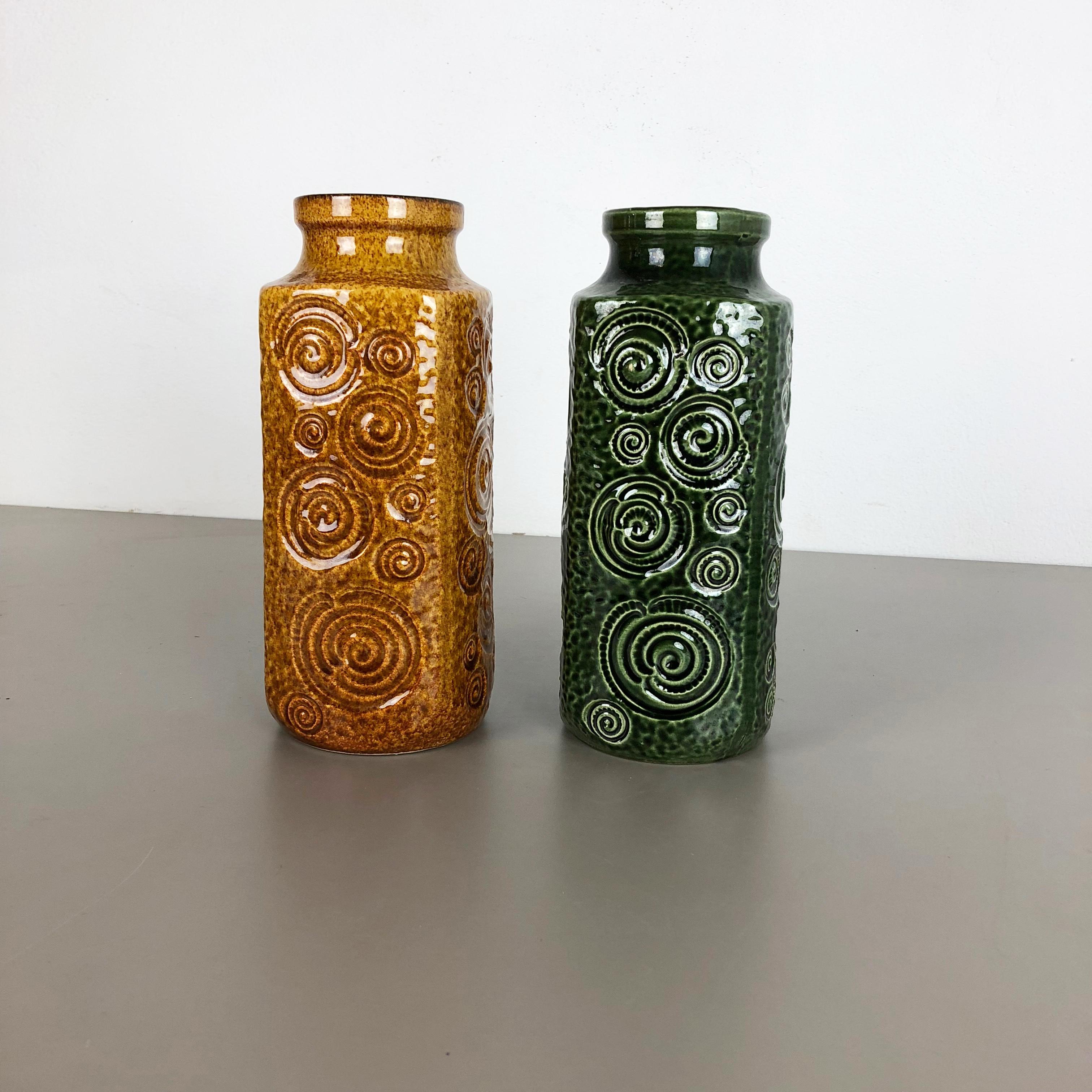 Article:

Set of two fat lava art vases

model: Jura 282-26


Producer:

Scheurich, Germany



Decade:

1970s


Description:

These original vintage vases was produced in the 1970s in Germany. It is made of ceramic pottery in fat