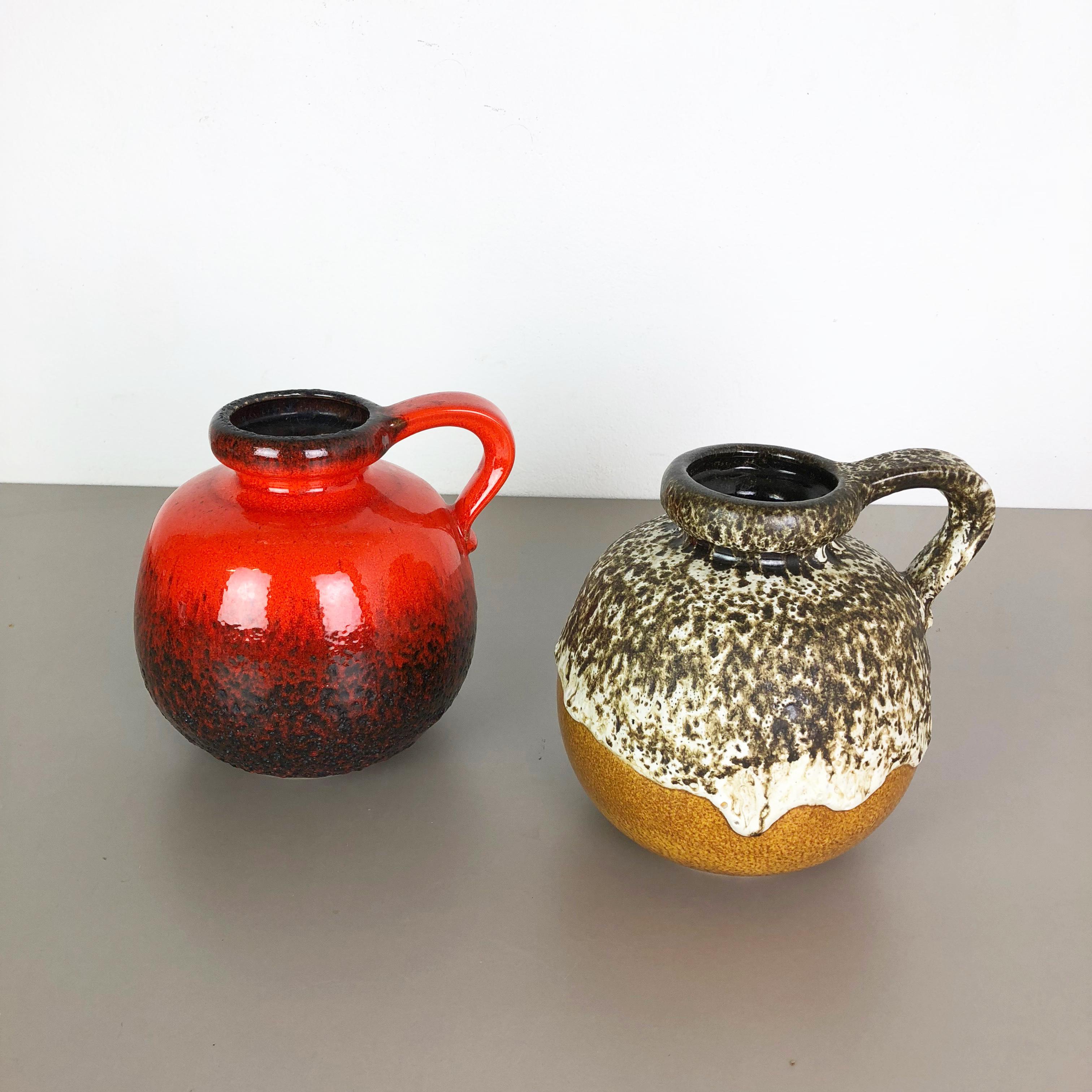 Article:

Set of two fat lava art vases

Model: 484-21


Producer:

Scheurich, Germany



Decade:

1970s




These original vintage vases was produced in the 1970s in Germany. It is made of ceramic pottery in fat lava optic.
