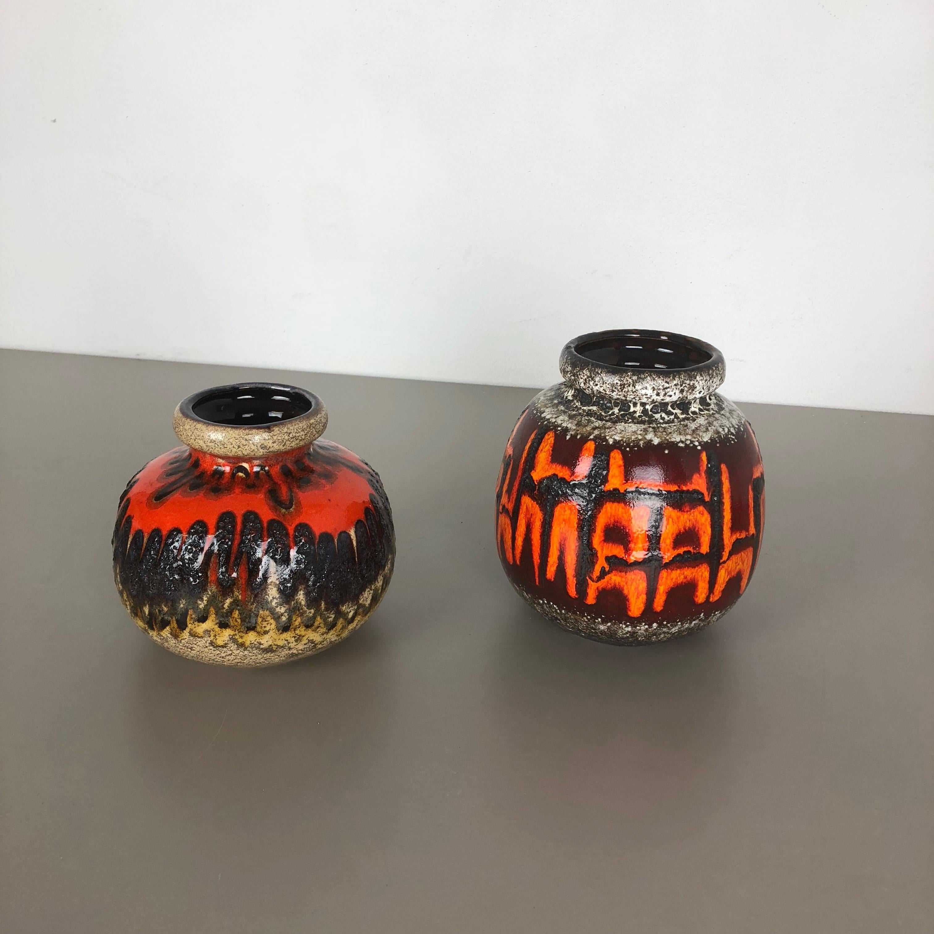 Article:

Set of two fat lava art vases

Model:
284-15
284-19



Producer:

Scheurich, Germany



Decade:

1970s




These original vintage vases was produced in the 1970s in Germany. It is made of ceramic pottery in fat lava