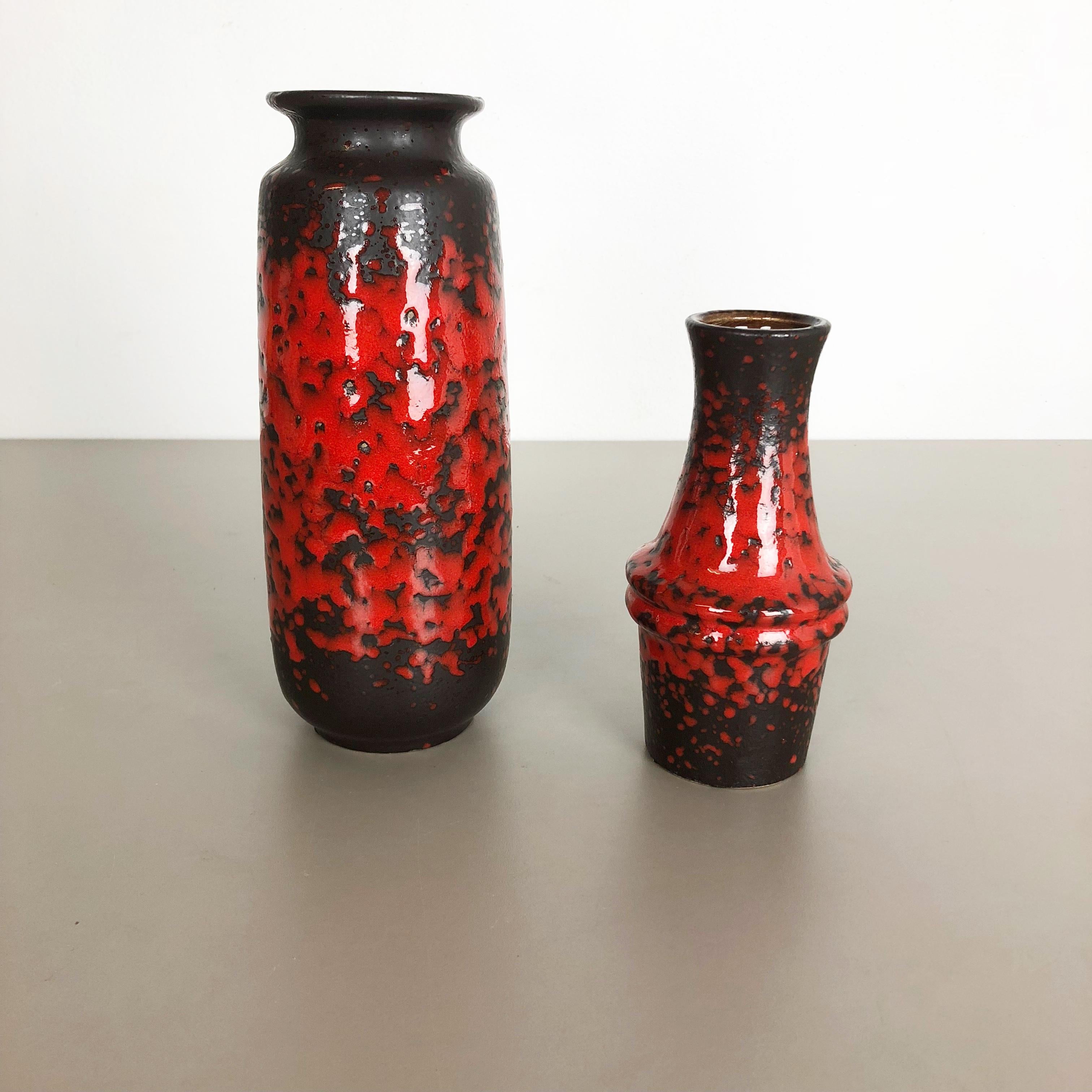 Article:

Set of two fat lava art vases

Model:
206-27
209-18



Producer:

Scheurich, Germany



Decade:

1970s




These original vintage vases was produced in the 1970s in Germany. It is made of ceramic pottery in fat lava