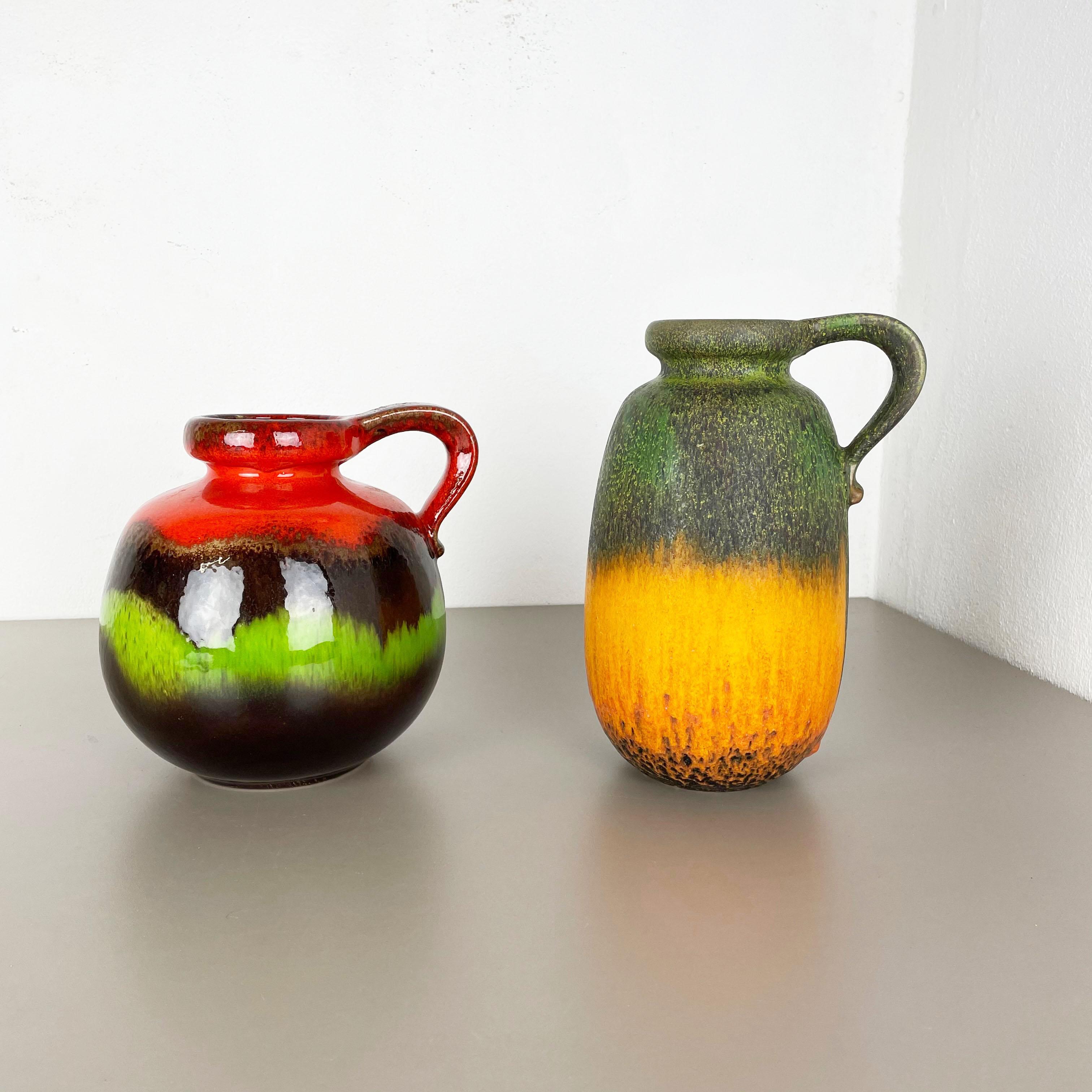 Article:

Set of two fat lava art vases



Producer:

Scheurich, Germany



Decade:

1970s




These original vintage vases was produced in the 1970s in Germany. It is made of ceramic pottery in fat lava optic. Super rare in this