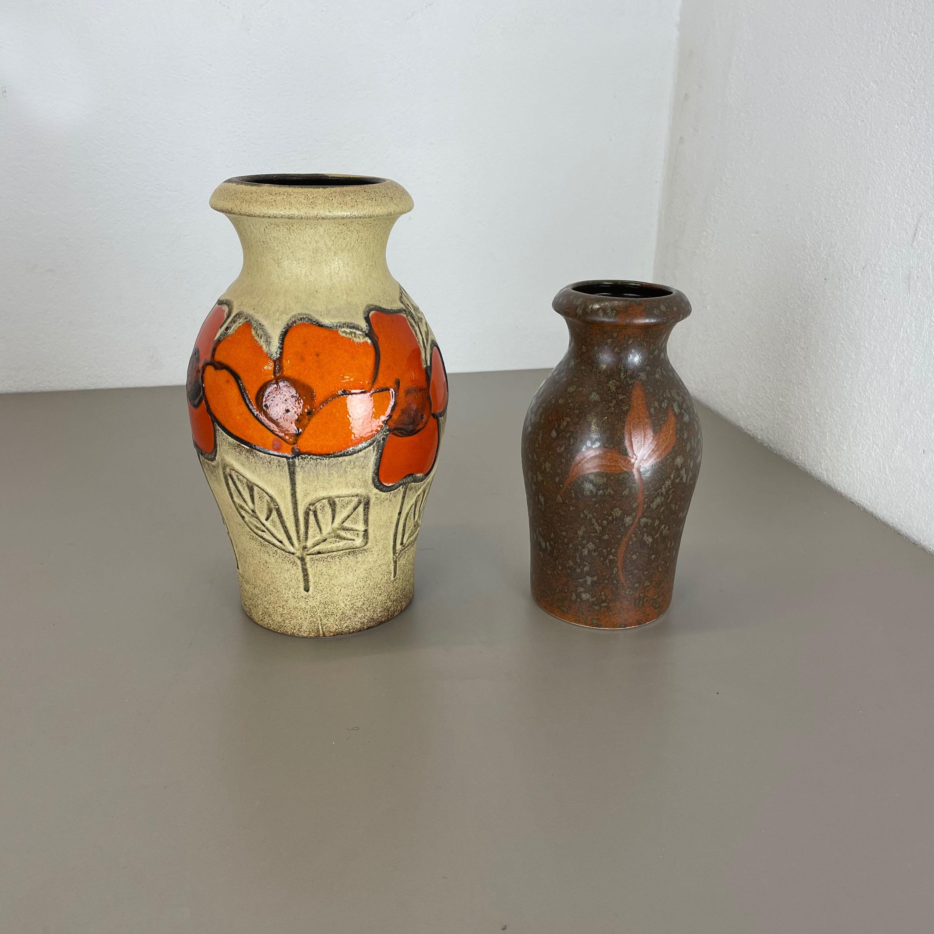 Article:

Set of two fat lava art vases


Producer:

Scheurich, Germany



Decade:

1970s




These original vintage vases was produced in the 1970s in Germany. It is made of ceramic pottery in fat lava optic. Super rare in this