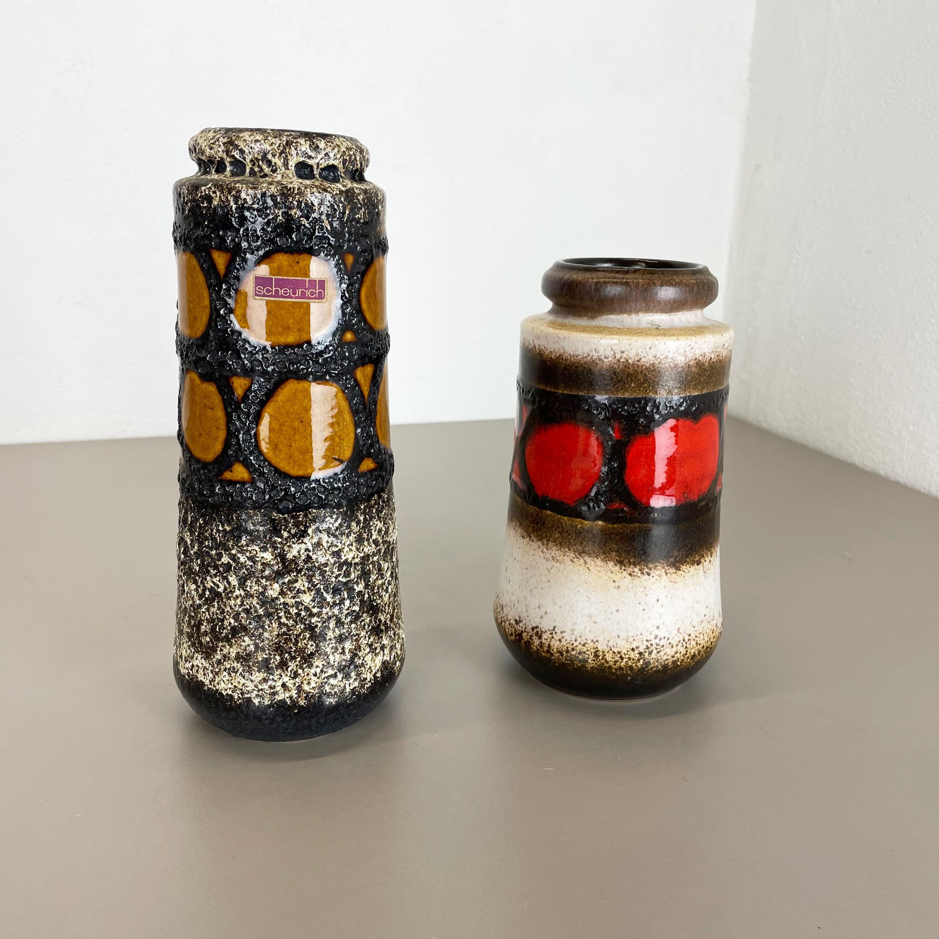 Article:

Set of two fat lava art vases


Producer:

Scheurich, Germany



Decade:

1970s




These original vintage vases was produced in the 1970s in Germany. It is made of ceramic pottery in fat lava optic. Super rare in this