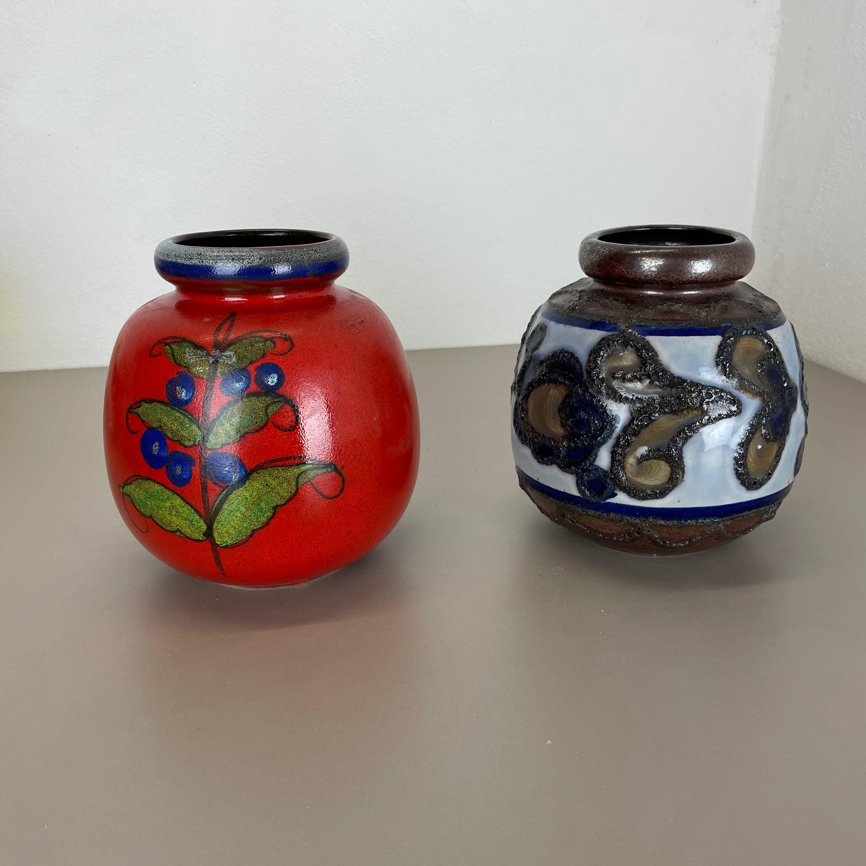 Article:

Set of two fat lava art vases




Producer:

Scheurich, Germany



Decade:

1970s




These original vintage vases was produced in the 1970s in Germany. It is made of ceramic pottery in fat lava optic. Super rare in