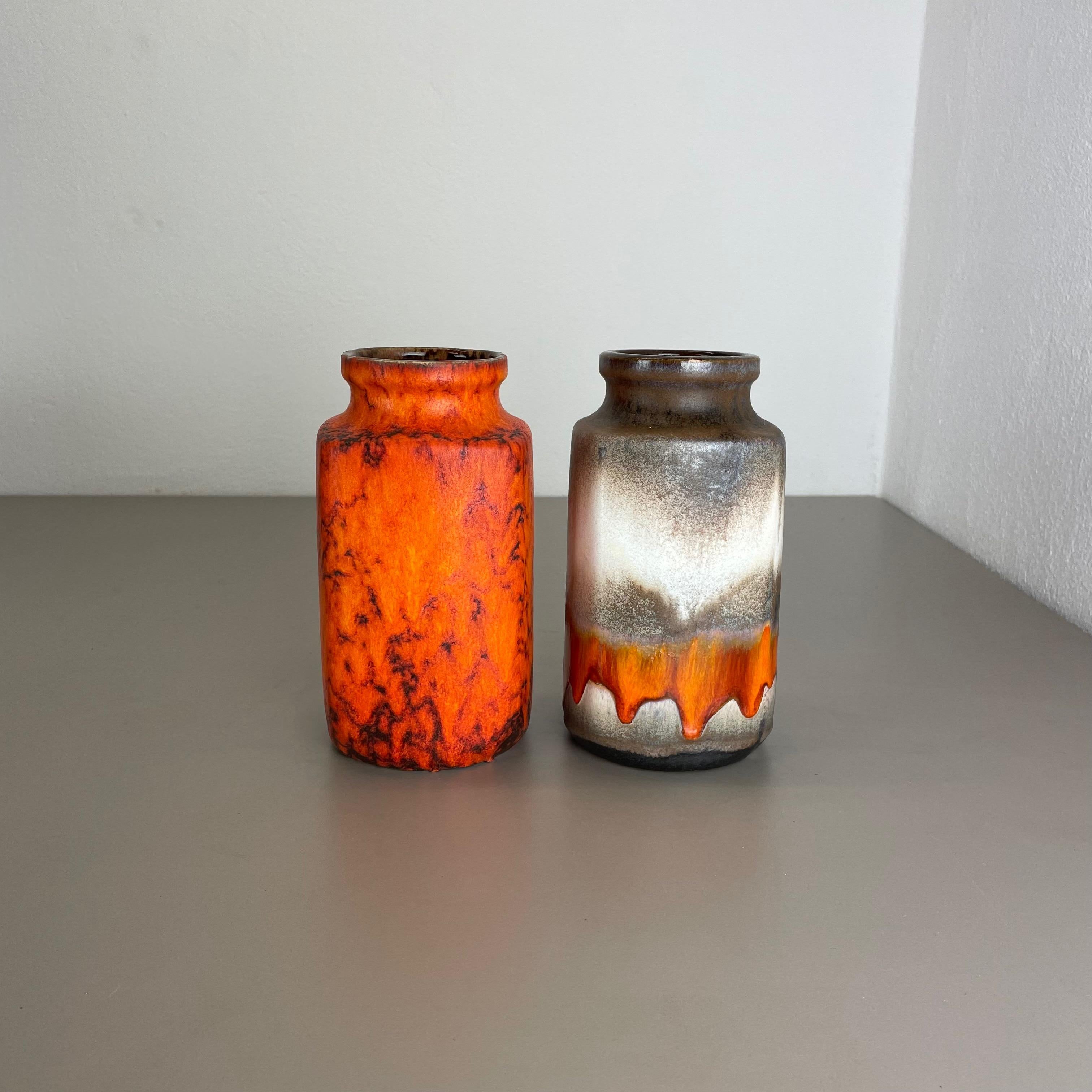 Article:

Set of two fat lava art vases


Producer:

Scheurich, Germany



Decade:

1970s




These original vintage vases was produced in the 1970s in Germany. It is made of ceramic pottery in fat lava optic. Super rare in this