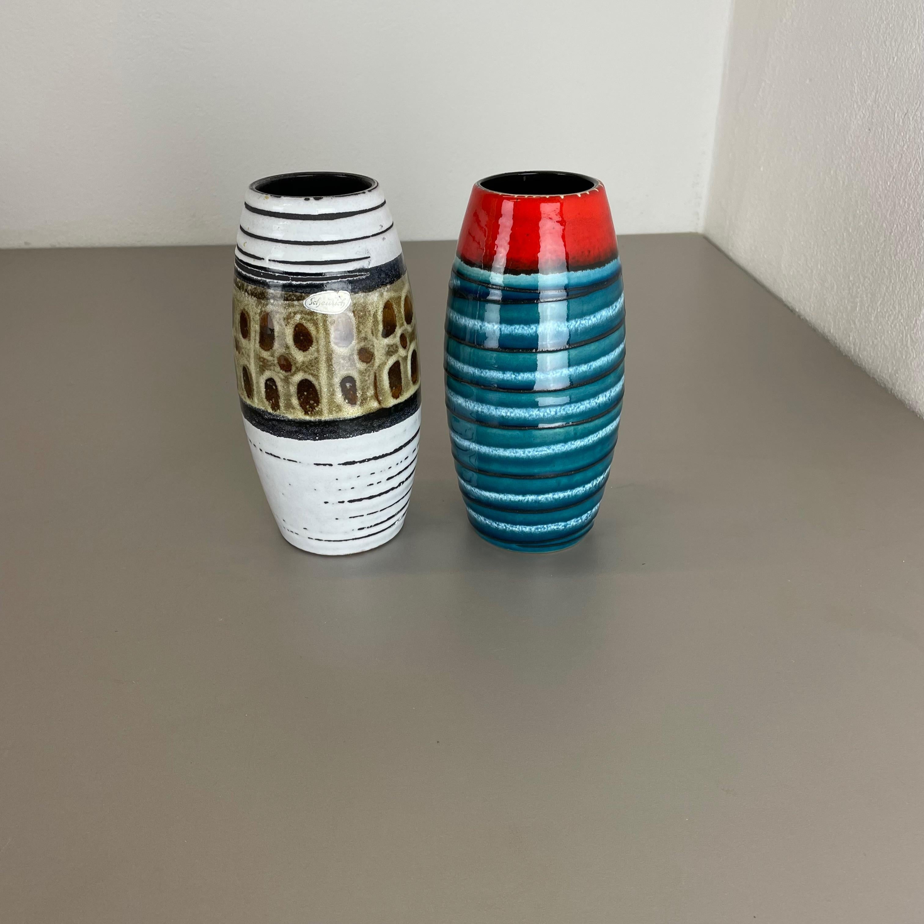 Article:

Set of two fat lava art vases


Producer:

Scheurich, Germany



Decade:

1950s




These original vintage vases was produced in the 1950s in Germany. It is made of ceramic pottery in fat lava optic. Super rare in this