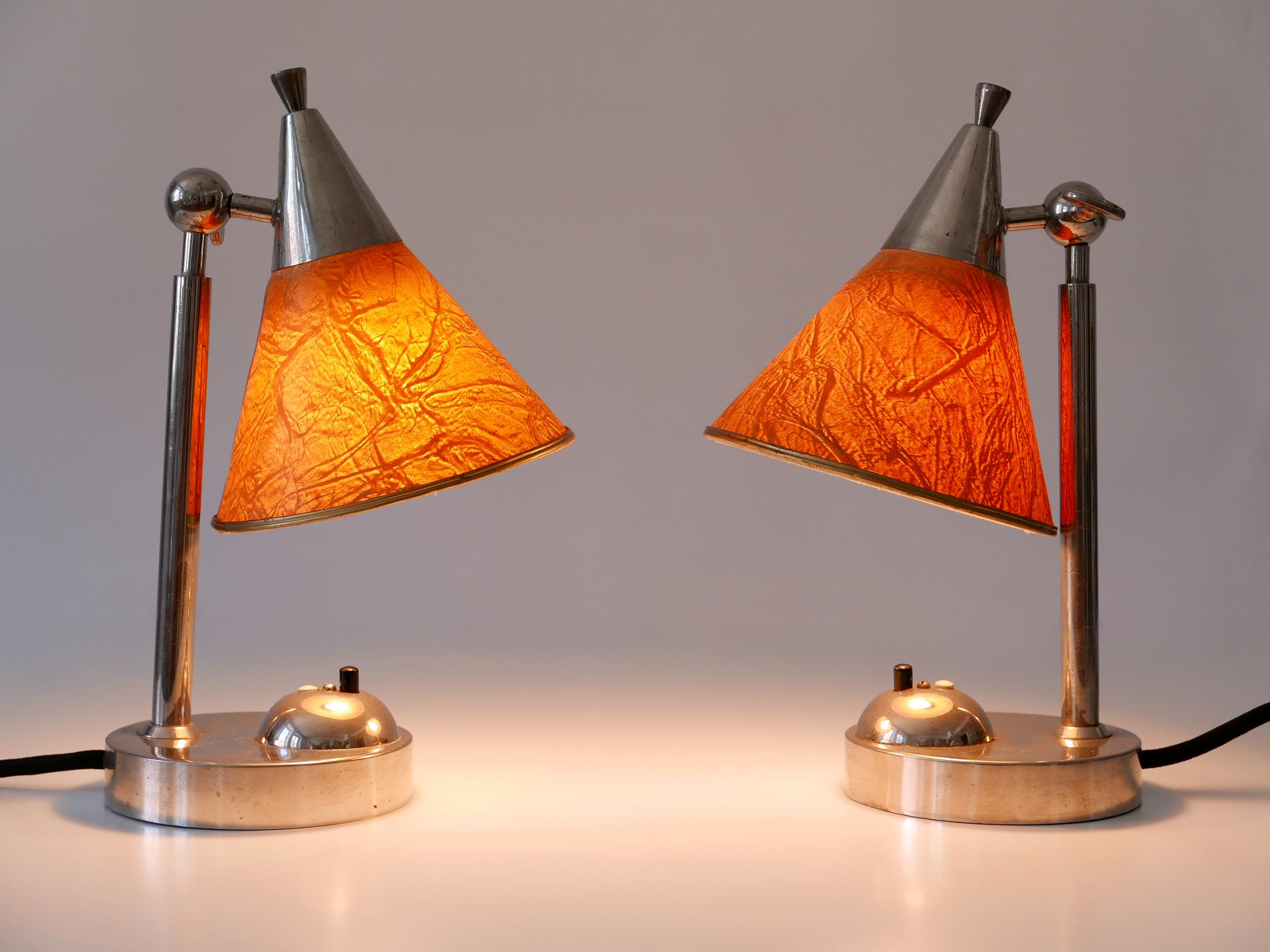 Extremely rare & elegant Art Deco or Bauhaus bedside table lamps or sconces. Adjustable lamp shades which are made of a special paper, called 