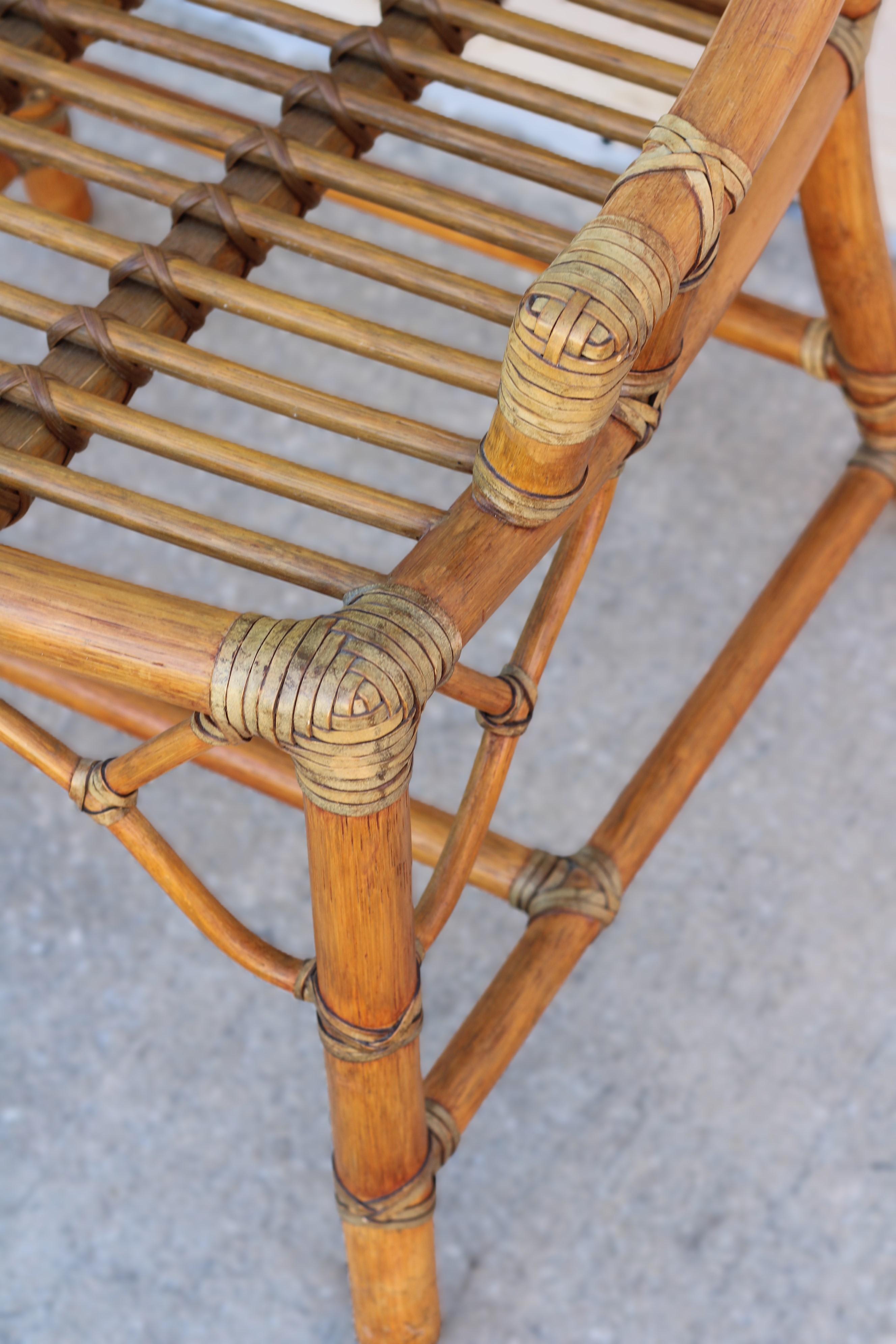 Pair of Rattan Cracked Ice Style Arm Chairs with Rolling Ottoman For Sale 3