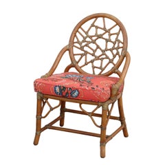 Pair of Rattan Cracked Ice Style Arm Chairs with Rolling Ottoman