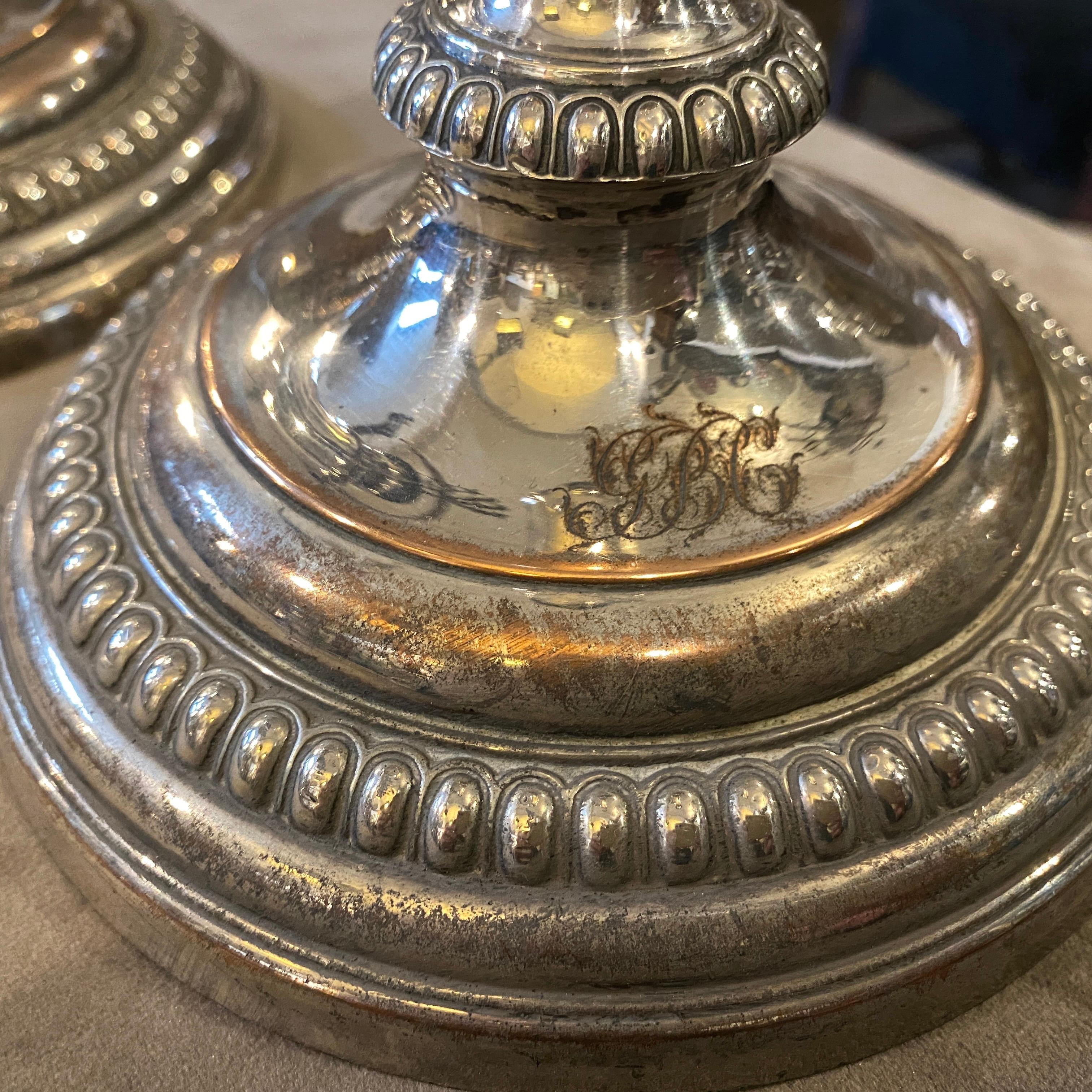 A superb pair of original Sheffield plate candlesticks made in England in 1835, original conditions, they have a monogram on the front of the base.