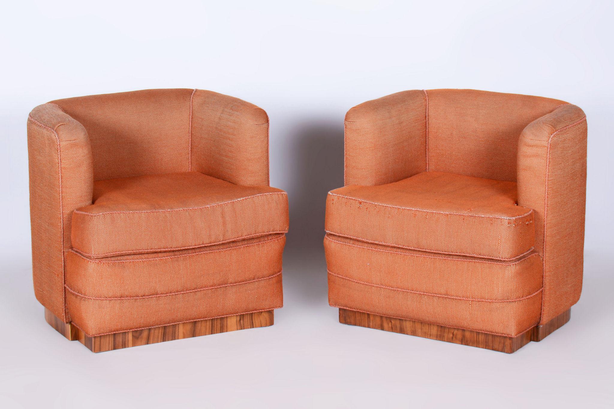 The armchairs come from the interior of the Slavia bank in Czechoslovakia.

Original preserved traditional spring upholstery.

The original cover fabric is slightly repaired, but is in good condition.

It has been re-polished with polyutherane piano