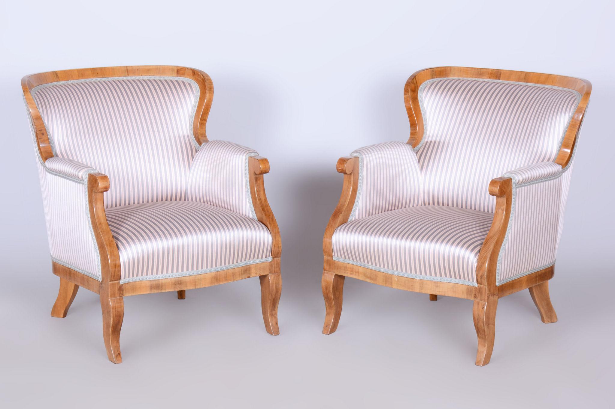 Restored Biedermeier Pair of Armchairs. 
Modernist Viennese model.

Source: Vienna, Austria
Period: 1830-1839
Material: Solid Oak, Spruce, Walnut

It has been re-polished with polyutherane piano lacquer by our professional refurbishing team in