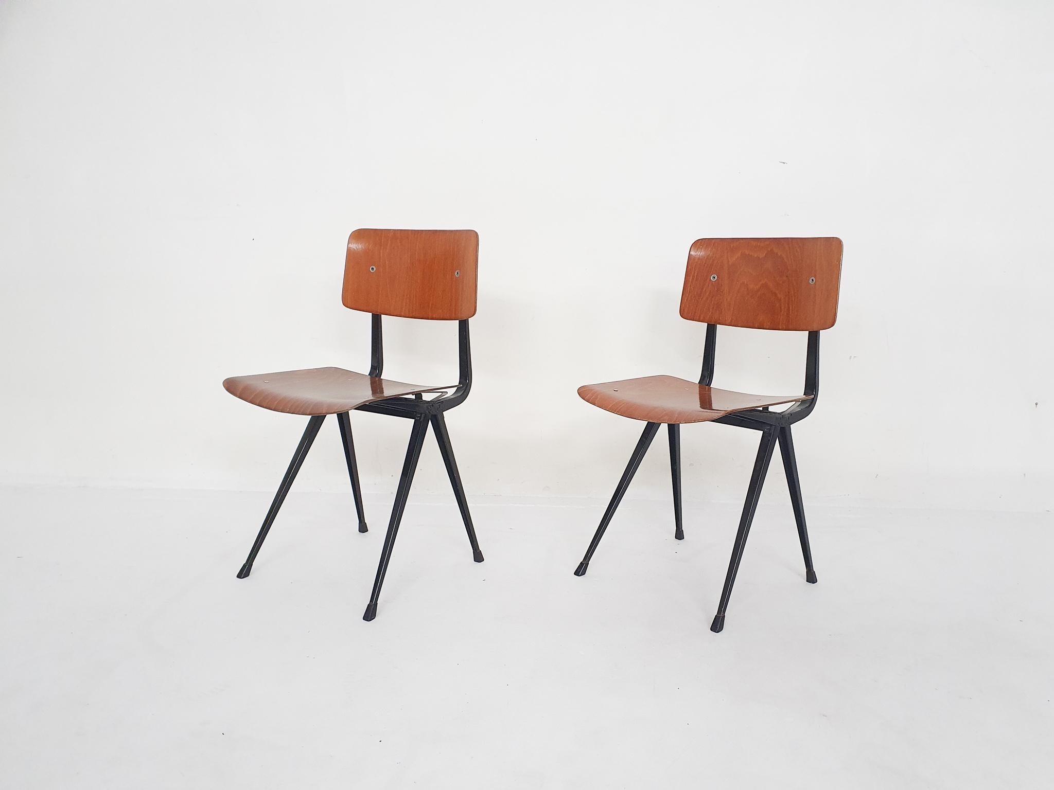 Set of two plywood industrial school chairs by Friso Kramer for Ahrend. In good original condition
Marked in the frame

Friso Kramer
Kramer is the son of architect Piet Kramer. In 1963 he founded, together with Wim Crouwel, Benno Wissing, Paul and