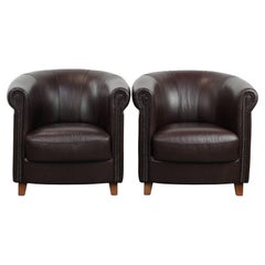 Set of two round leather club armchairs in English style