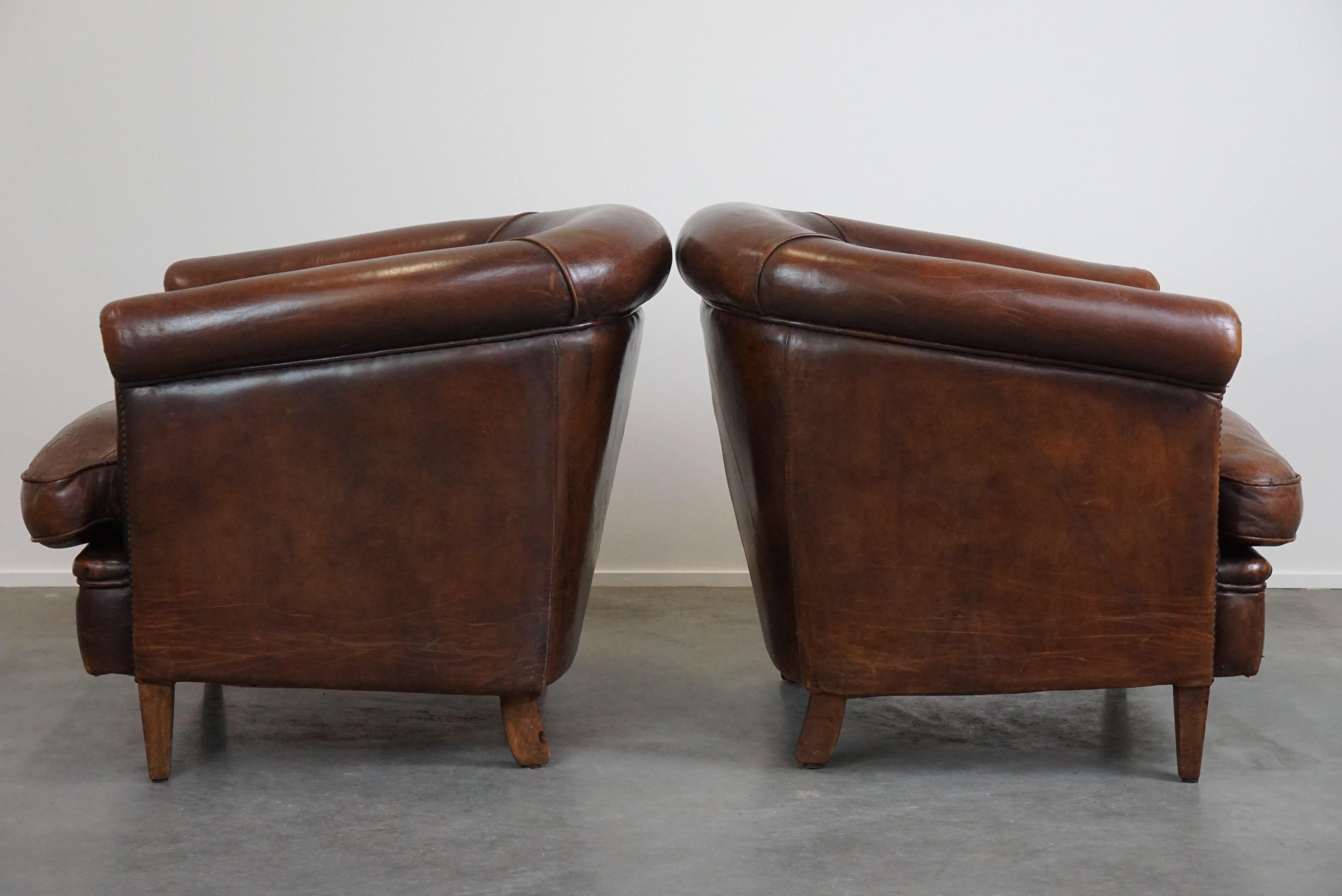 Set of two rugged sheep leather club armchairs with a beautifully worn look In Fair Condition For Sale In Harderwijk, NL