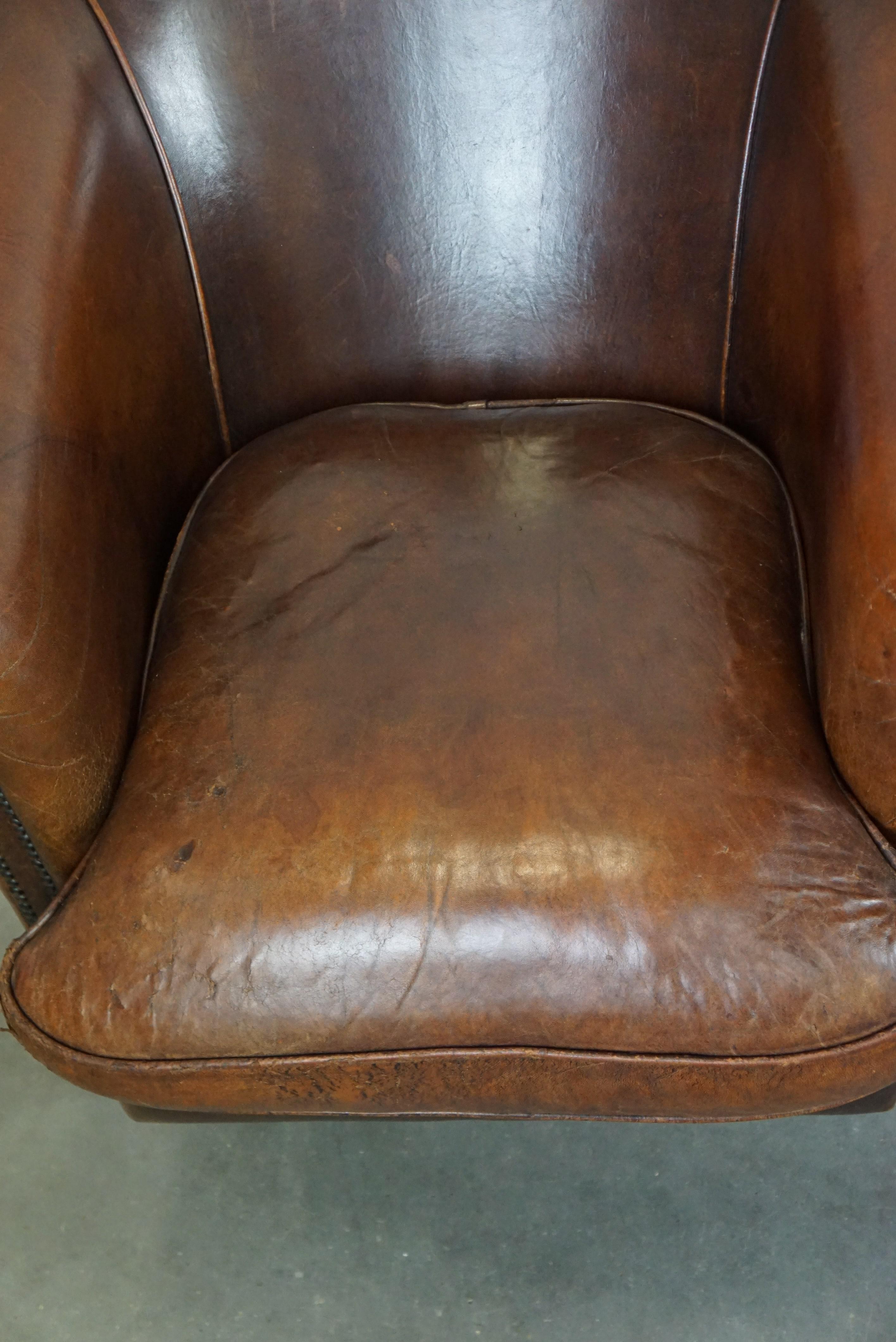 Contemporary Set of two rugged sheep leather club armchairs with a beautifully worn look For Sale
