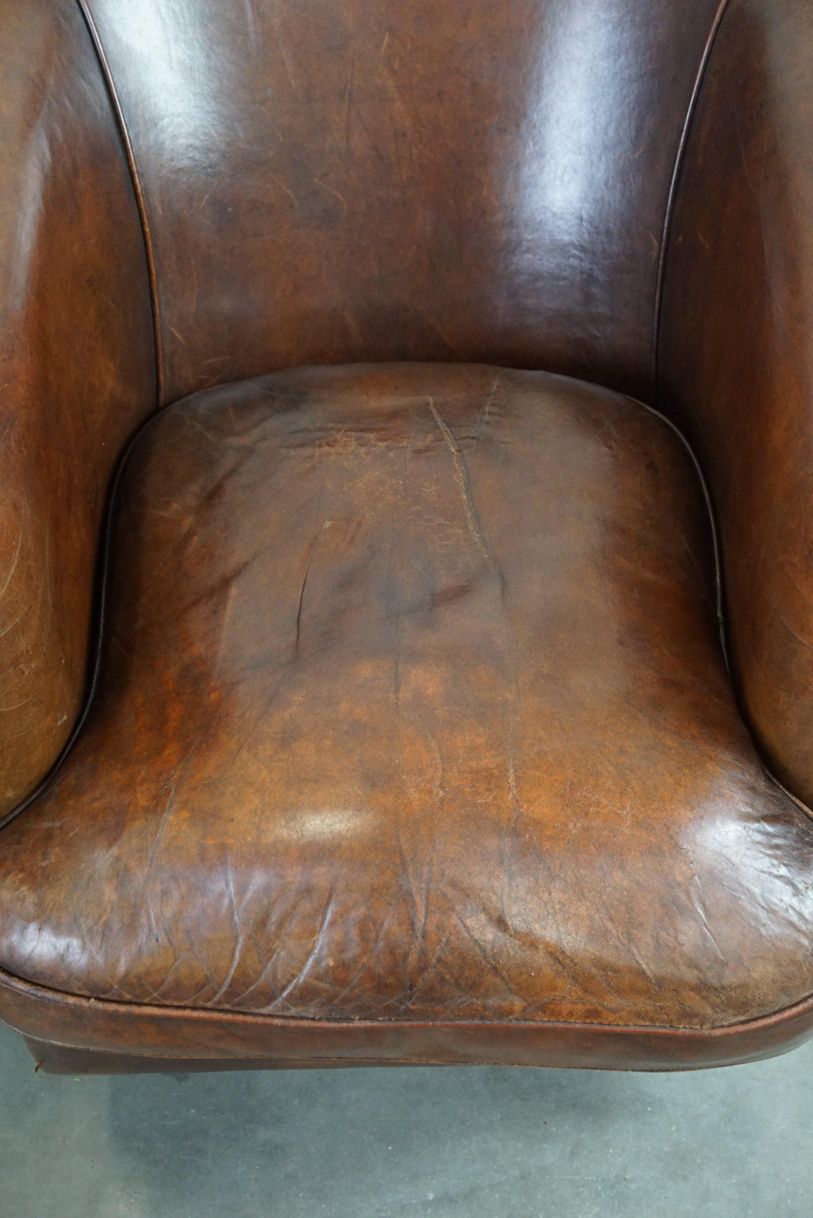 Leather Set of two rugged sheep leather club armchairs with a beautifully worn look For Sale