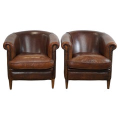 Set of two rugged sheep leather club armchairs with a beautifully worn look