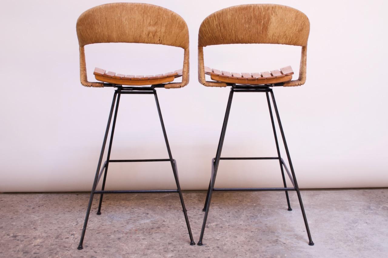 Mid-20th Century Set of Two Rush and Iron Swiveling Stools by Arthur Umanoff, Five Available
