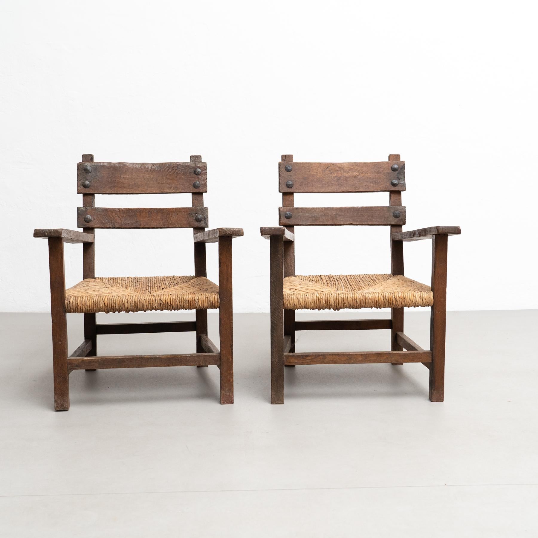 Mid-Century Modern Set of Two Rustic Early 20th Century Armchairs in Solid Wood and Rattan For Sale