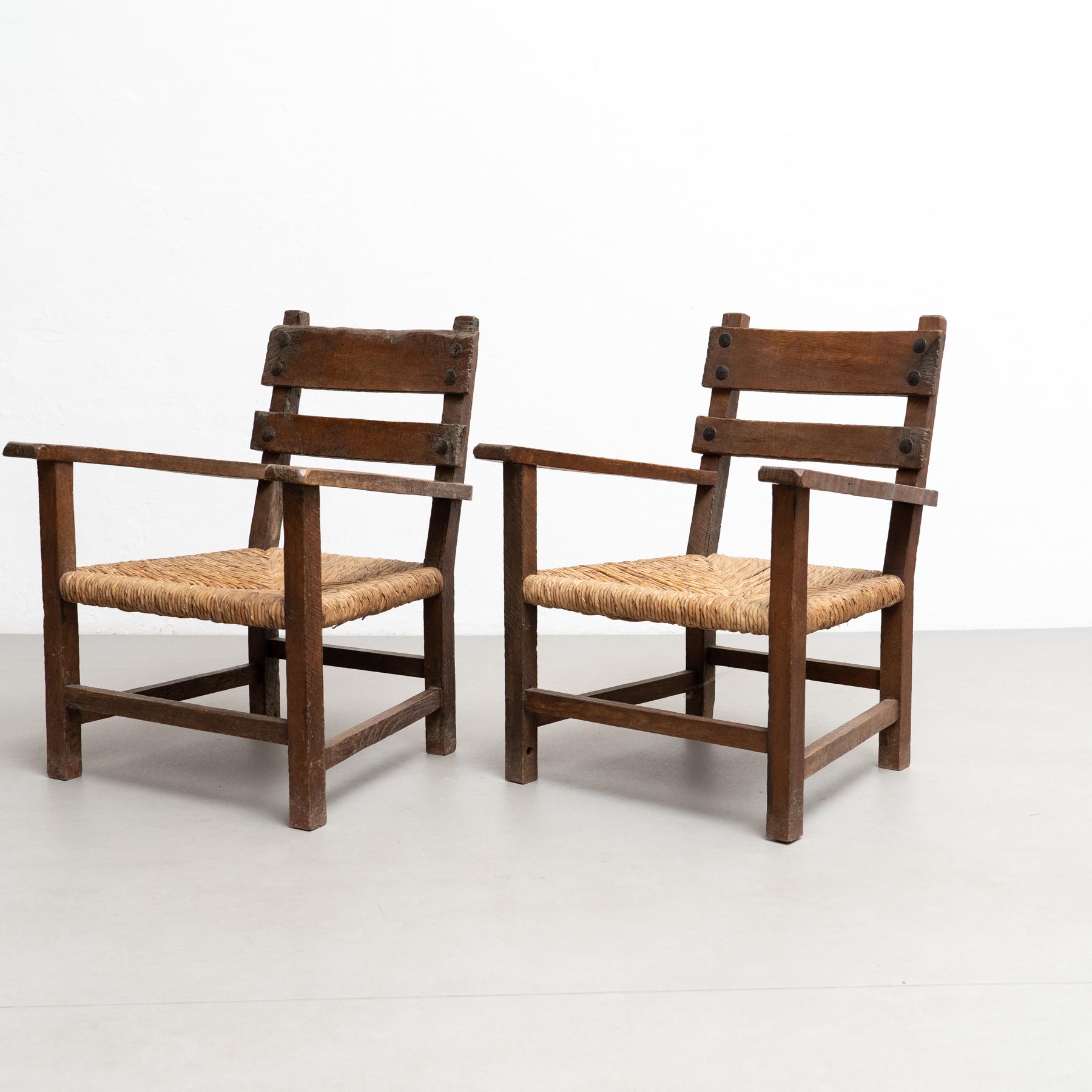 French Set of Two Rustic Early 20th Century Armchairs in Solid Wood and Rattan For Sale